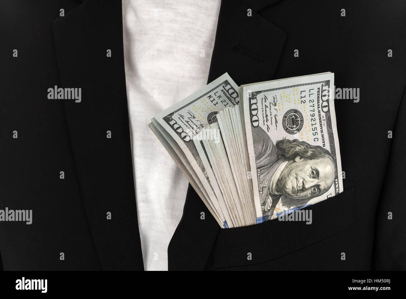 Business man Displaying a Spread of Dollar Stock Photo - Alamy