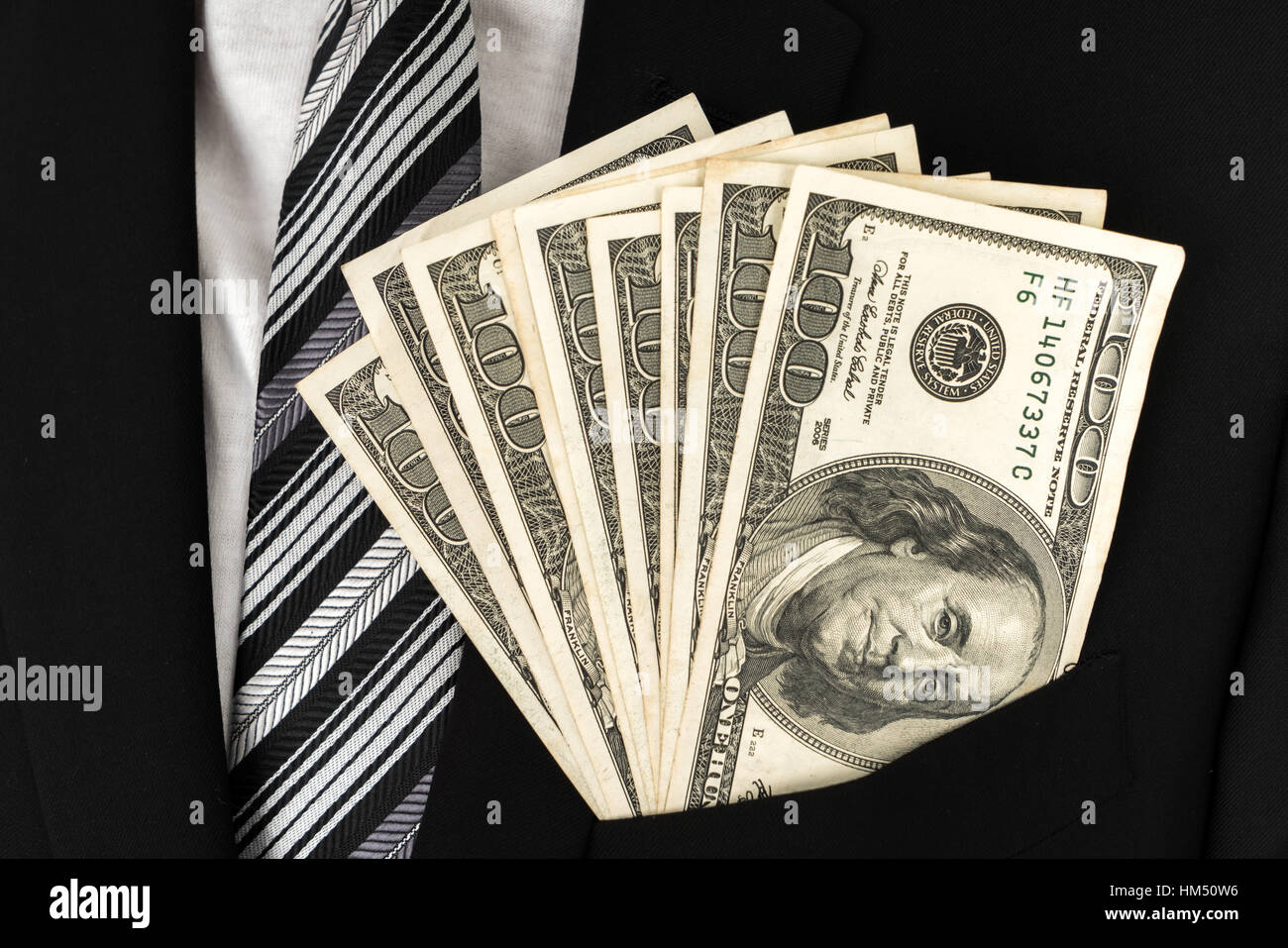 Business man Displaying a Spread of Dollar Stock Photo - Alamy