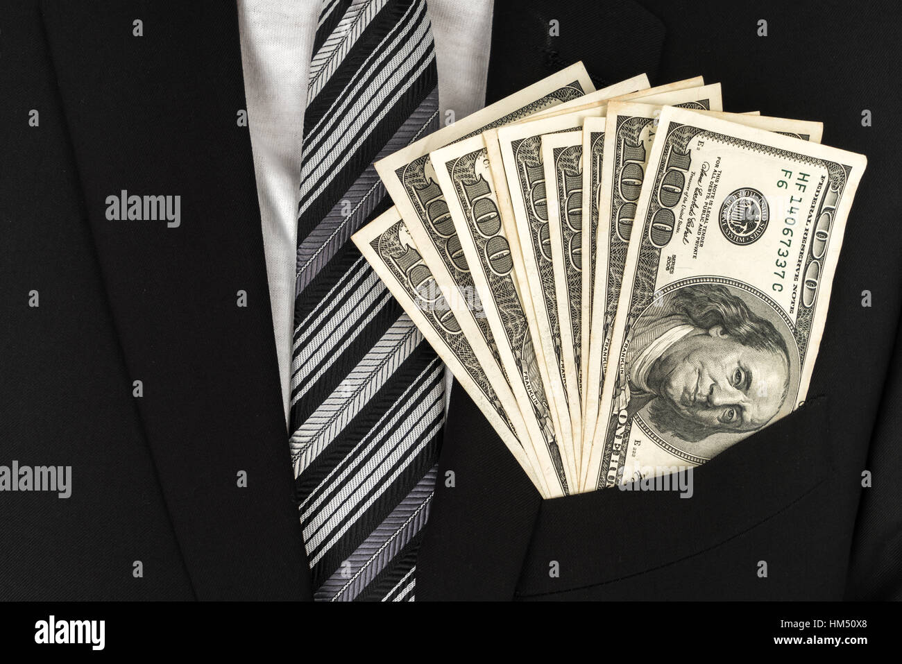 Business man Displaying a Spread of Dollar Stock Photo - Alamy