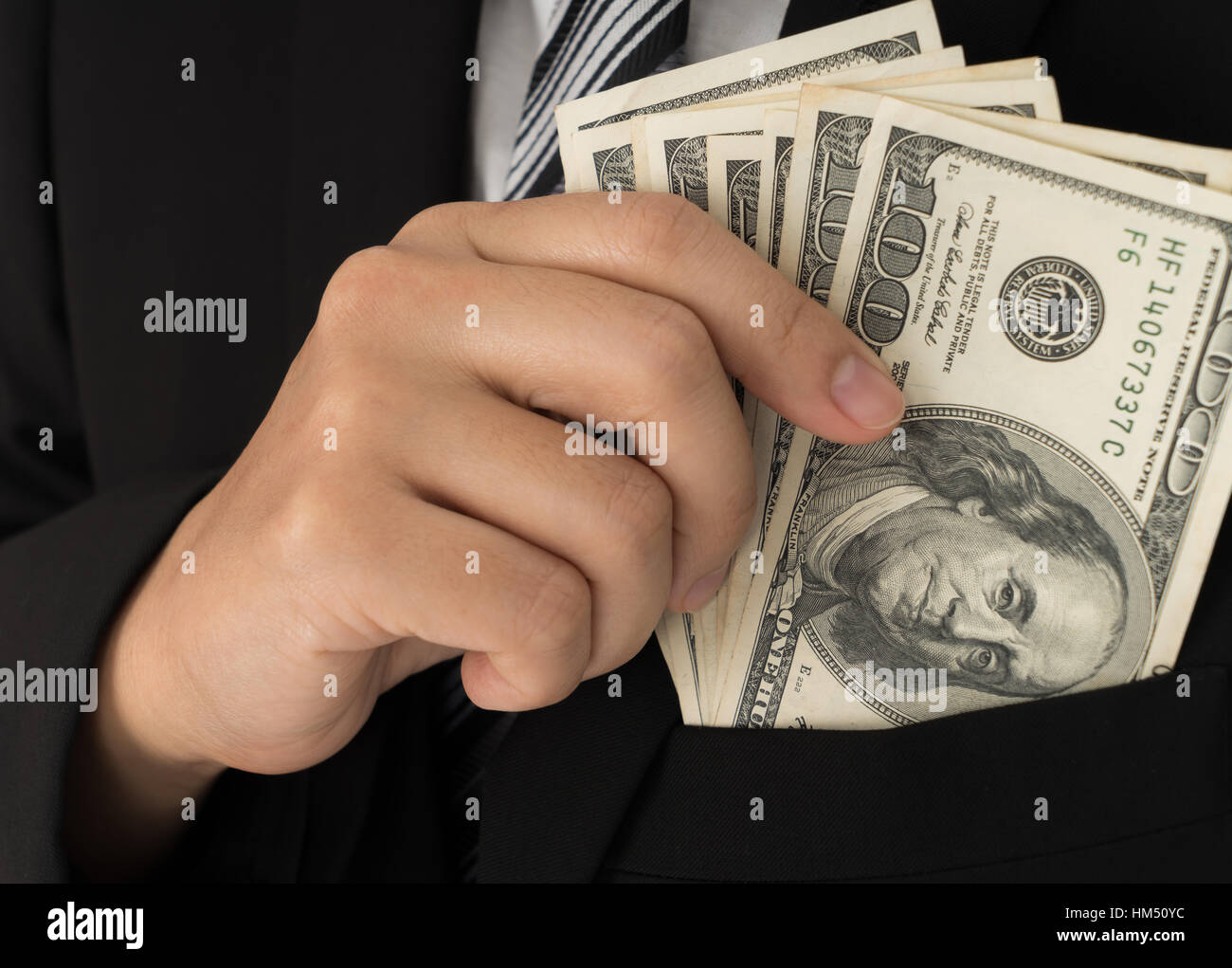 Business man Displaying a Spread of Dollar Stock Photo - Alamy