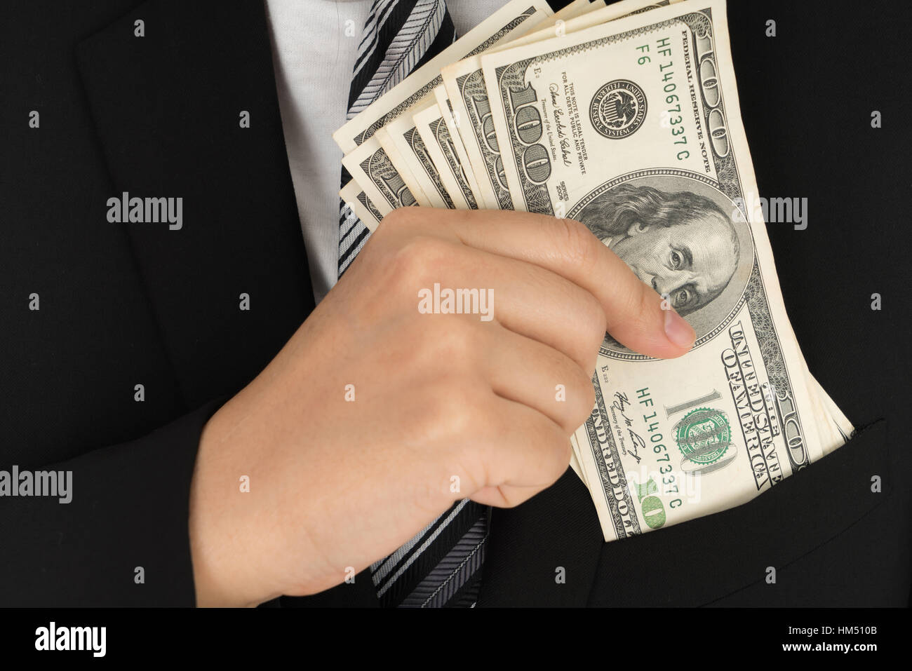 Business man Displaying a Spread of Dollar Stock Photo - Alamy
