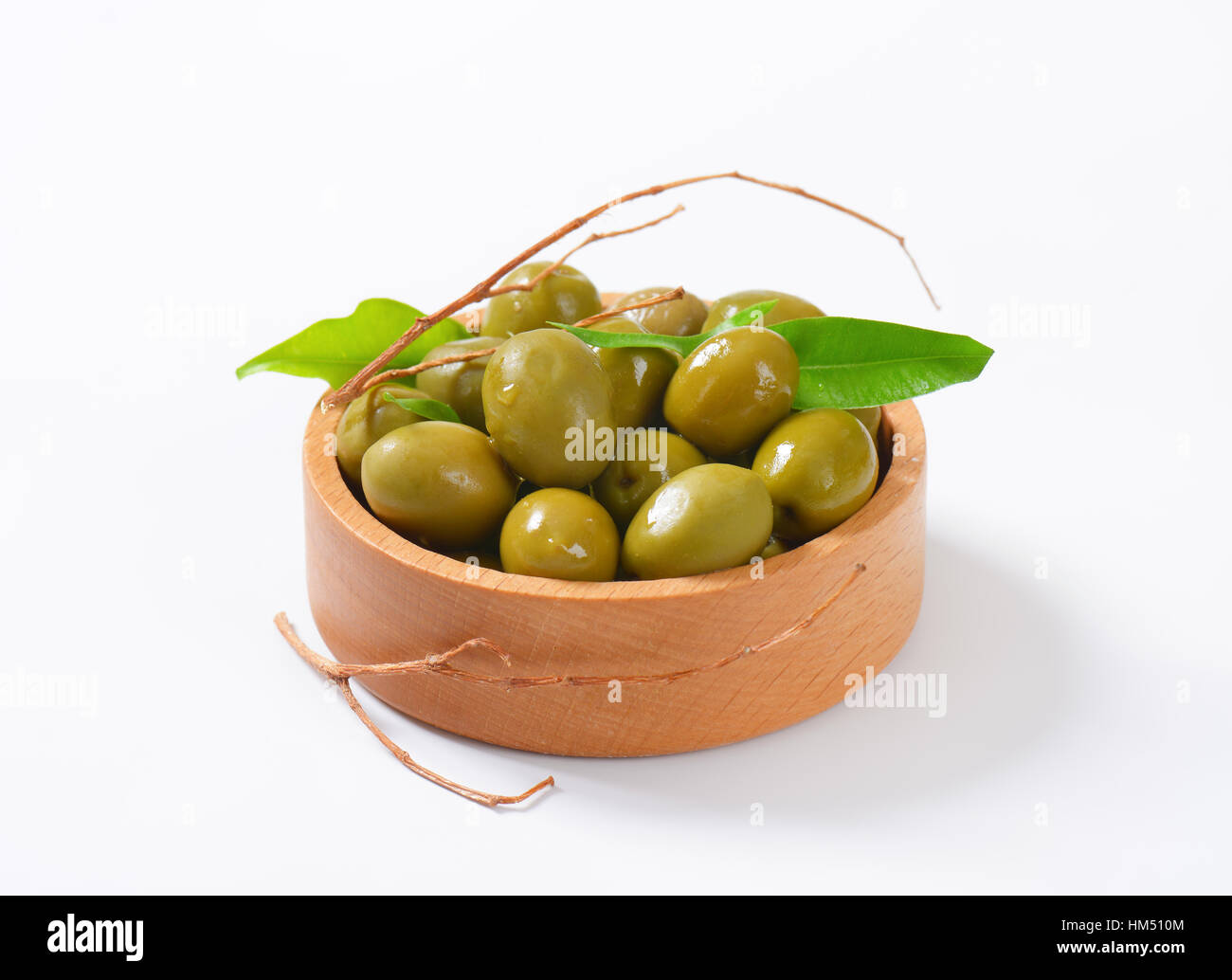 bowl of green olives on white background Stock Photo - Alamy
