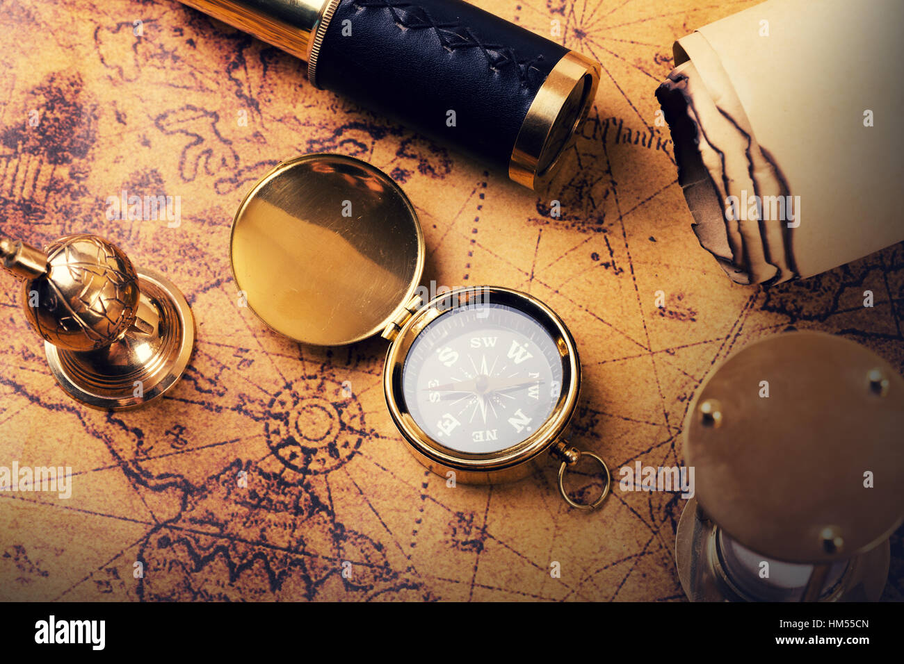 vintage compass and equipment on ancient treasure map Stock Photo