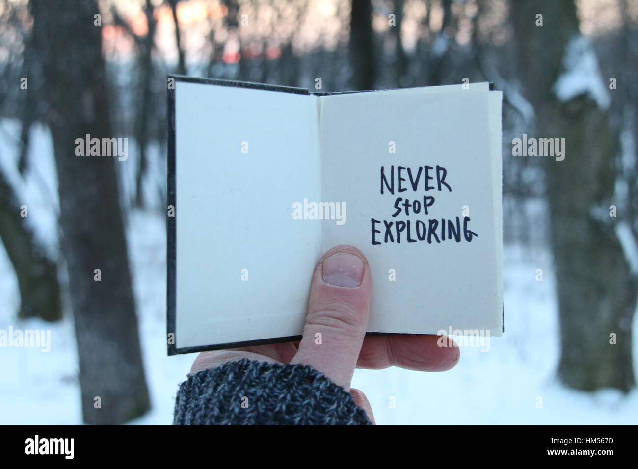 Never stop exploring. Inspirational and motivational quotes. . Book  text. Stock Photo