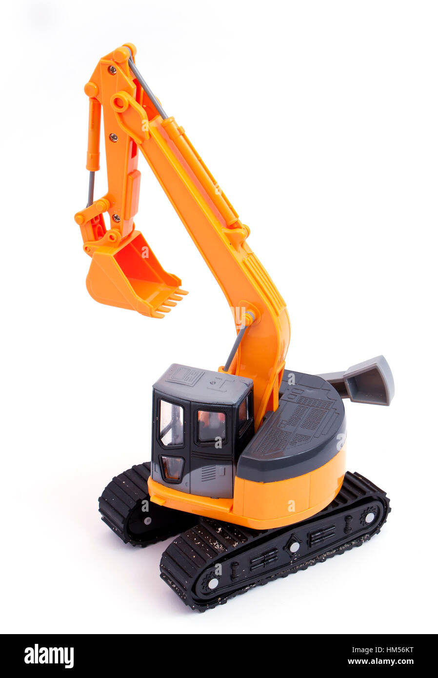 Toy tracked excavator with sand on the tracks Stock Photo - Alamy