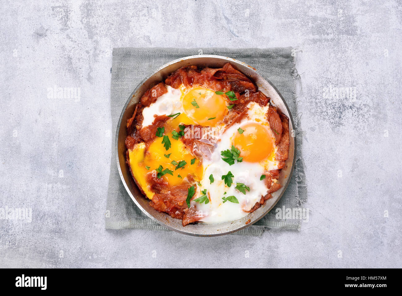 Fried eggs with salami in frying pan, top view Stock Photo Alamy