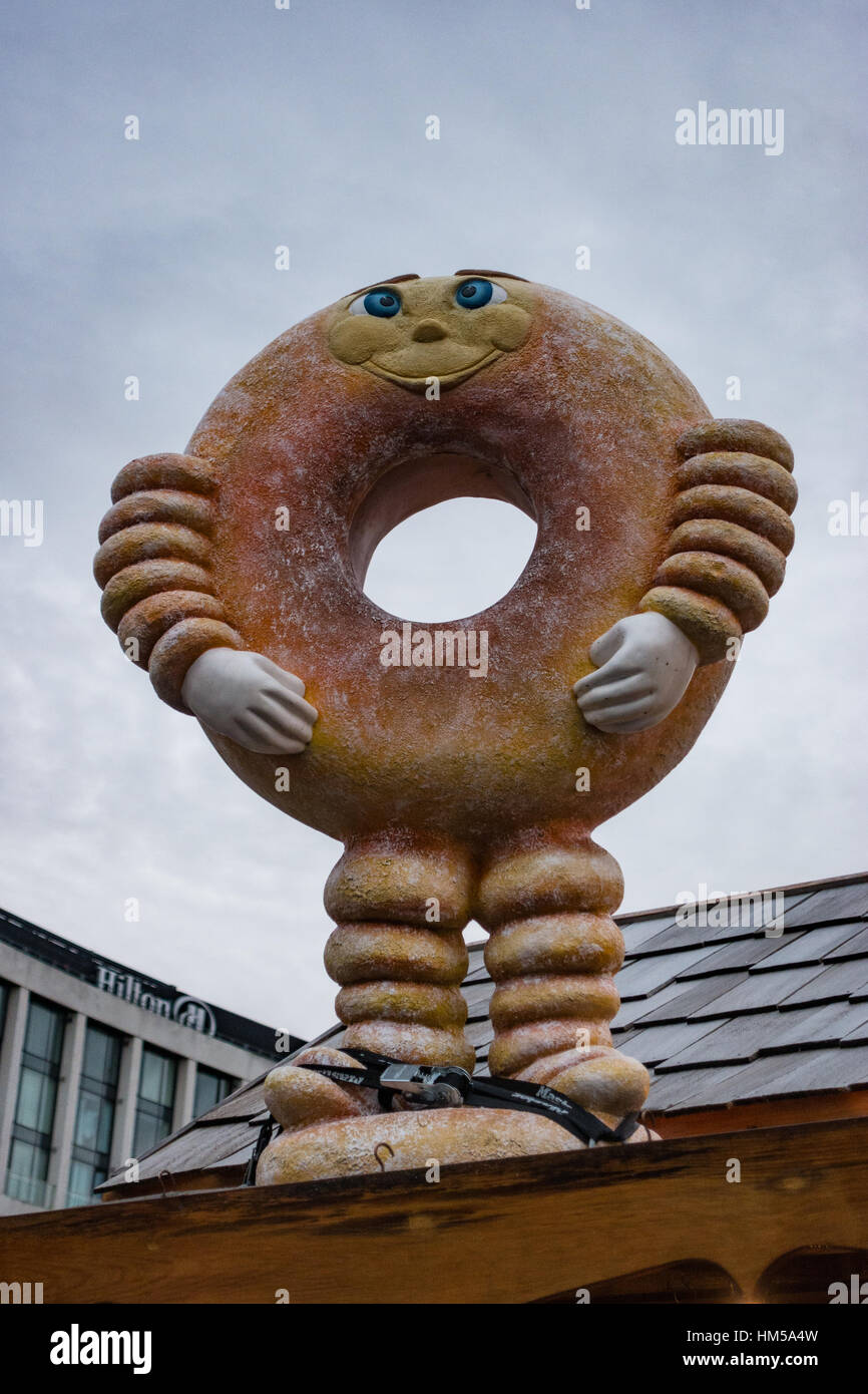 Giant Doughnut looks down on Liverpool One Christmas Fair Stock Photo