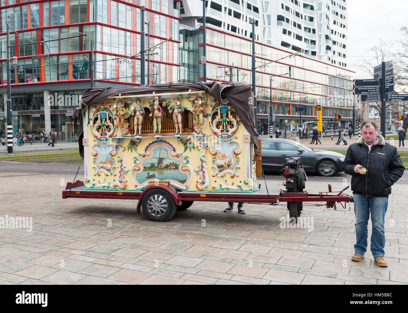 ROTTERDAM, THE NETHERLANDS - JANUARY 28 2017: Man with  Barrel organ or street organ  plays music in the center of Rotterdam for the Chinese new years Stock Photo