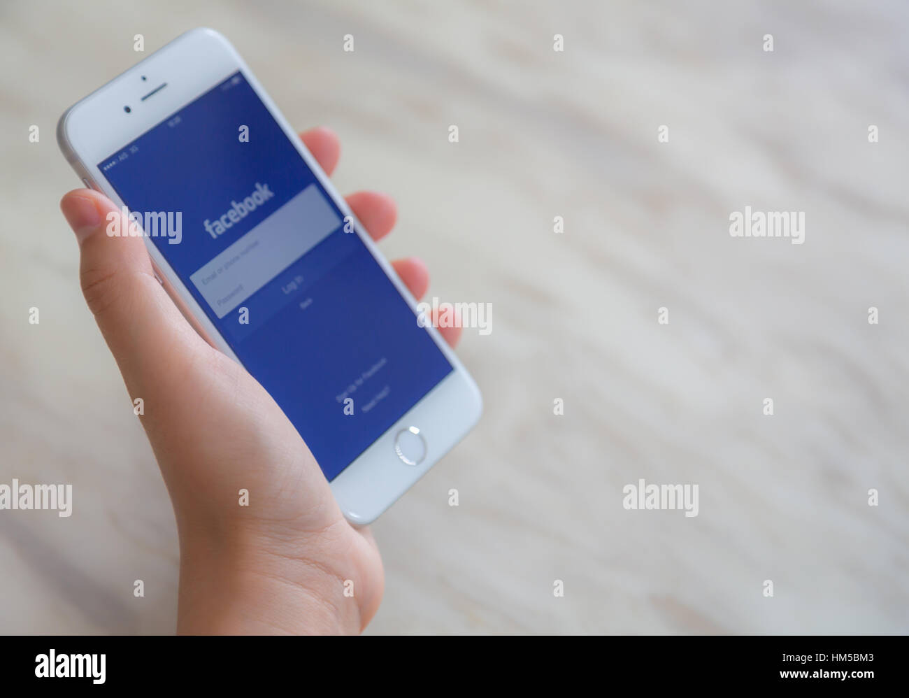 Loei, Thailand - July 12, 2015: Hand holding Iphone with mobile ...