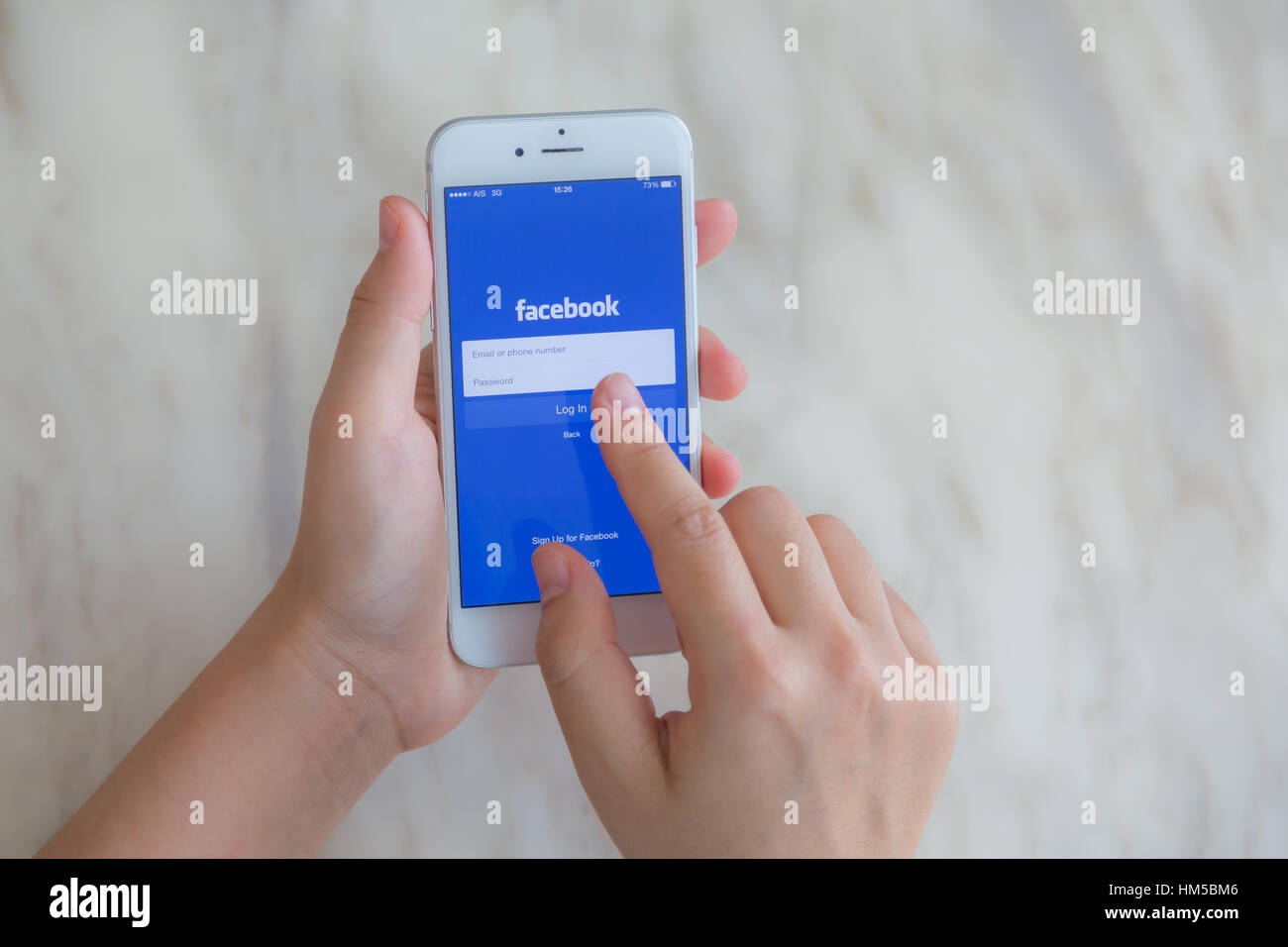 Loei, Thailand - July 12, 2015: Hand holding Iphone with mobile ...