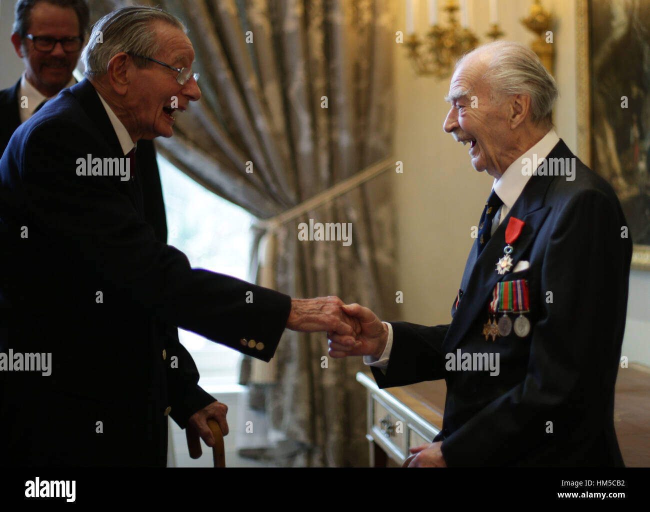 Victor J. Syborn (right), 96, from Chiswick, Lieutenant in the 5th Regt. Royal Marines Armoured Support Group, with Edgar Pearce, 92, from Hertfordshire, Sergeant in the army, during a ceremony for the Legion d'honneur, France's highest distinction, during a ceremony at the French Ambassador's Residence in London. Stock Photo