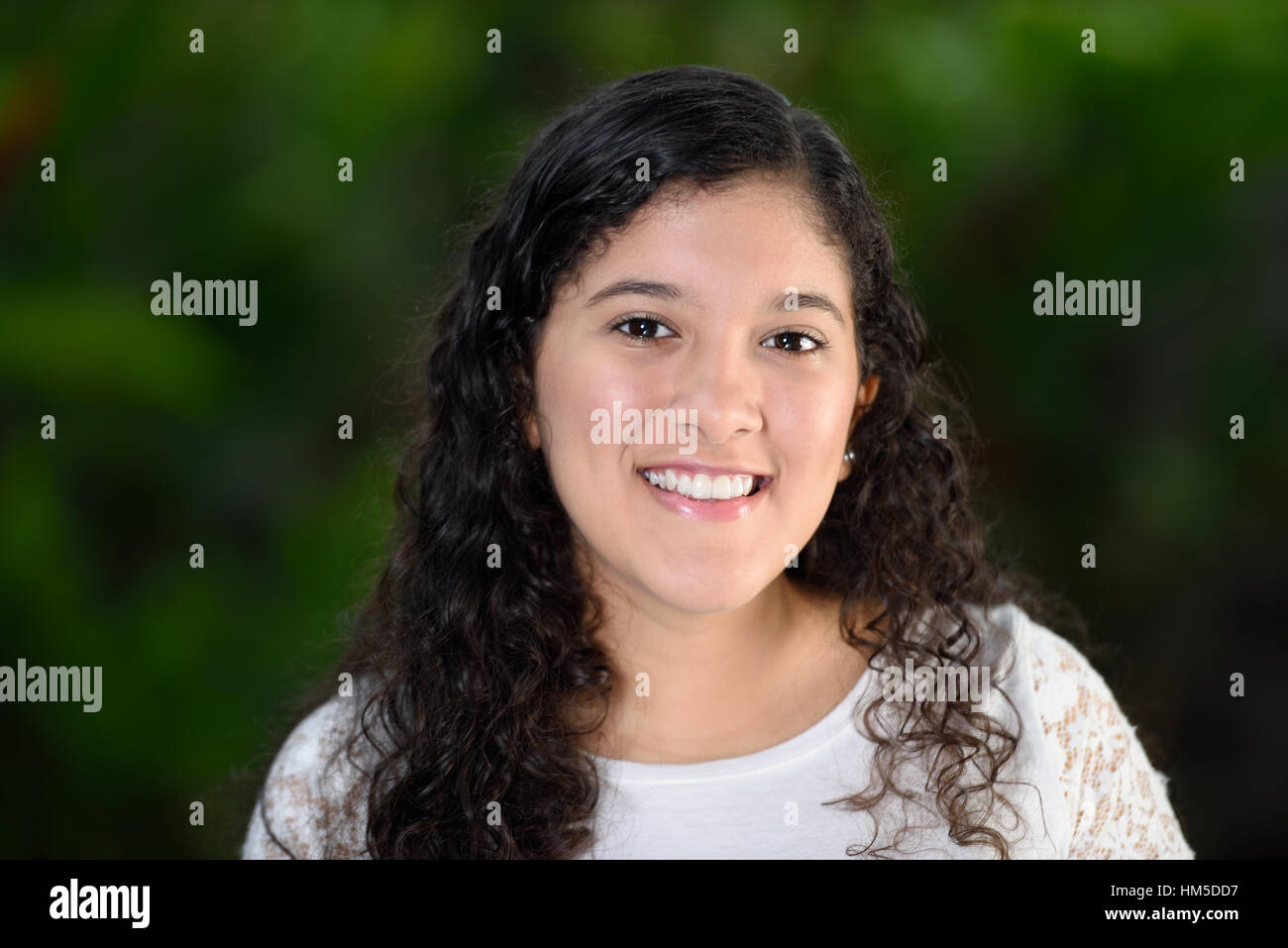 Curly teen girl smiling Stock Photo