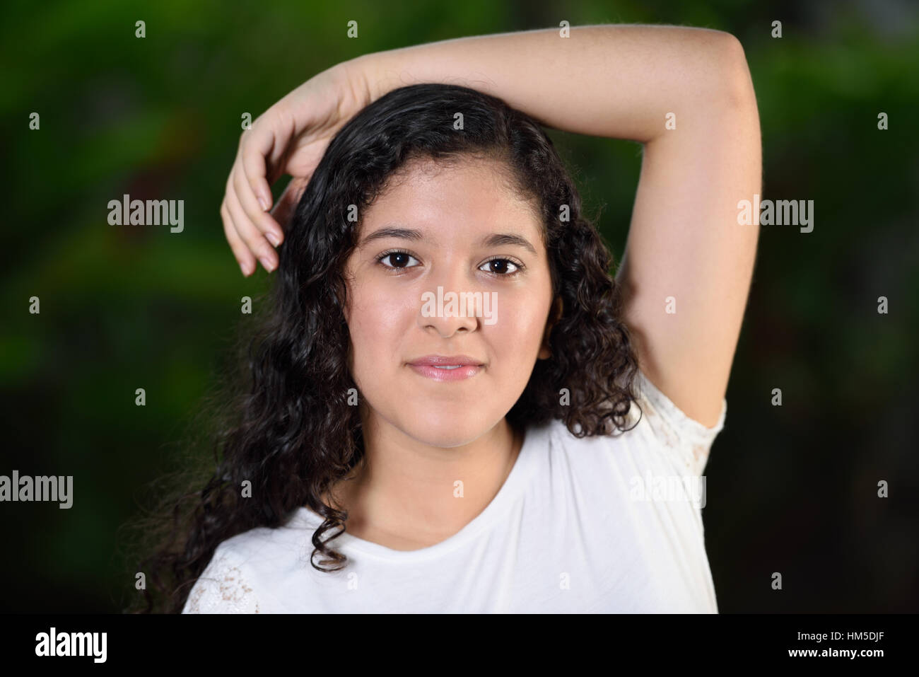 teenage with her arm resting on top of her head Stock Photo Alamy