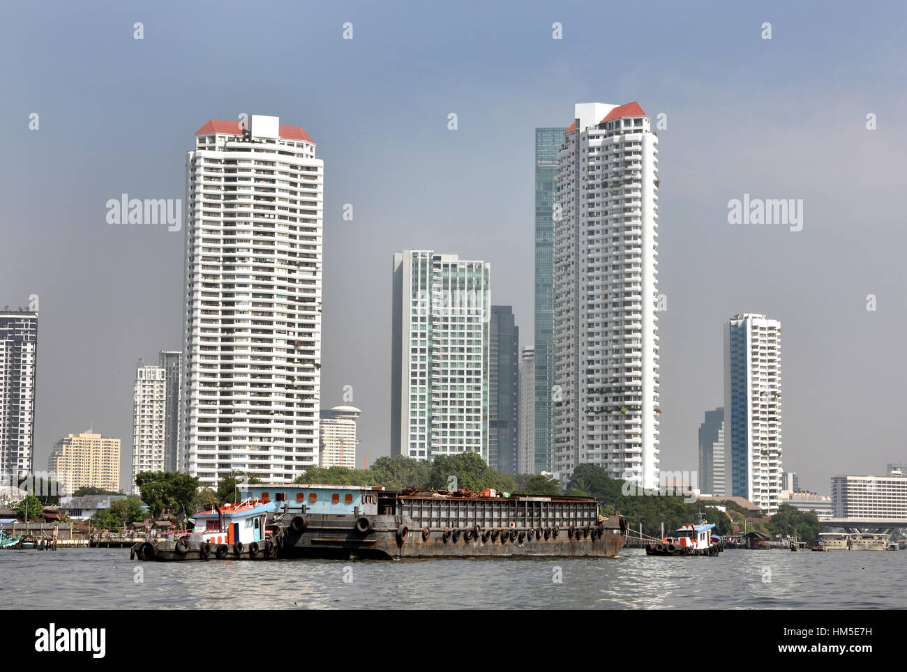 Traffic on the Chao Phraya River and Bangkok skyline Thailand Stock ...