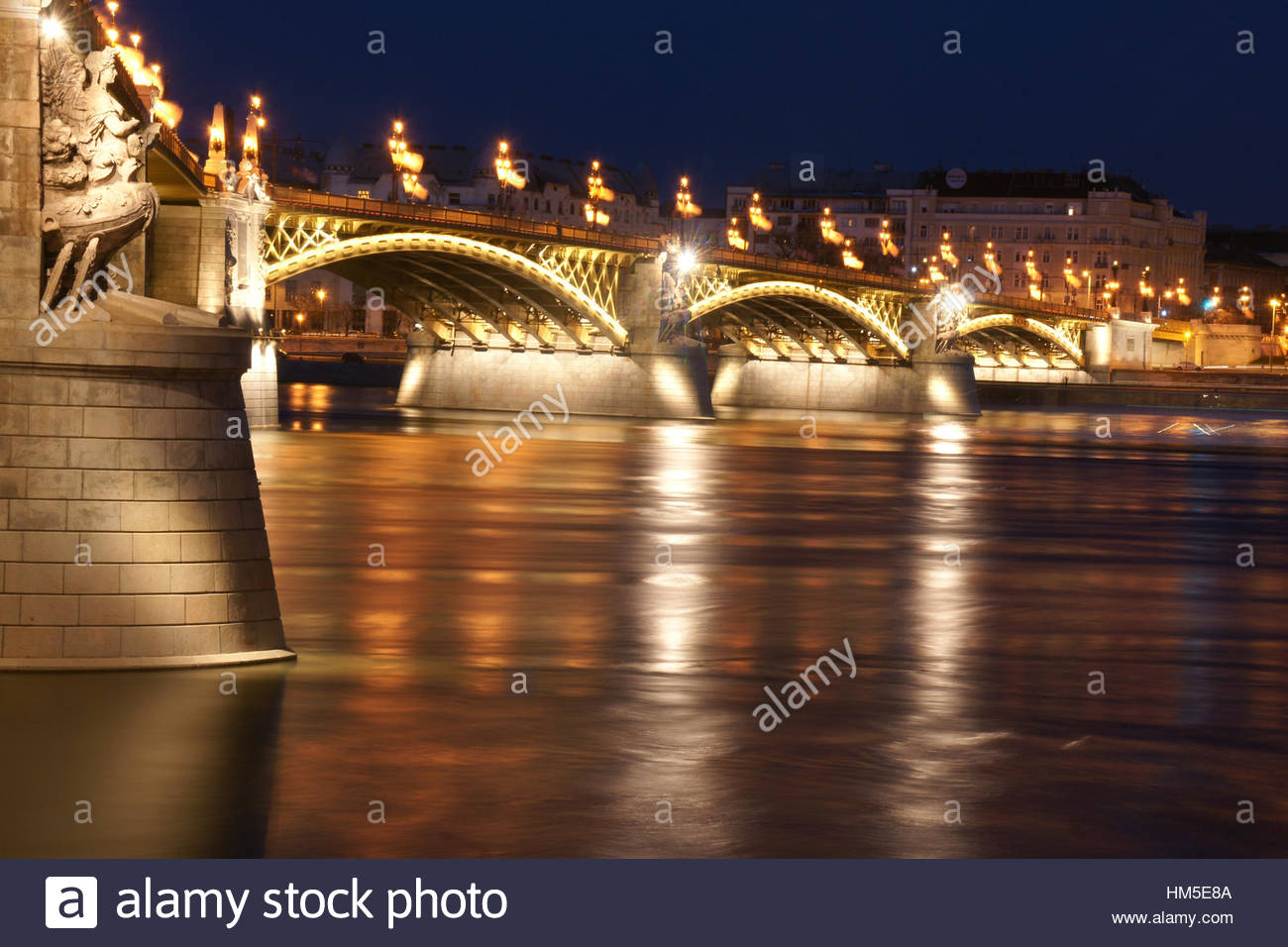 A shot of margit bridge in Budapest, Hungary by night as the Danube flows underneath. Stock Photo