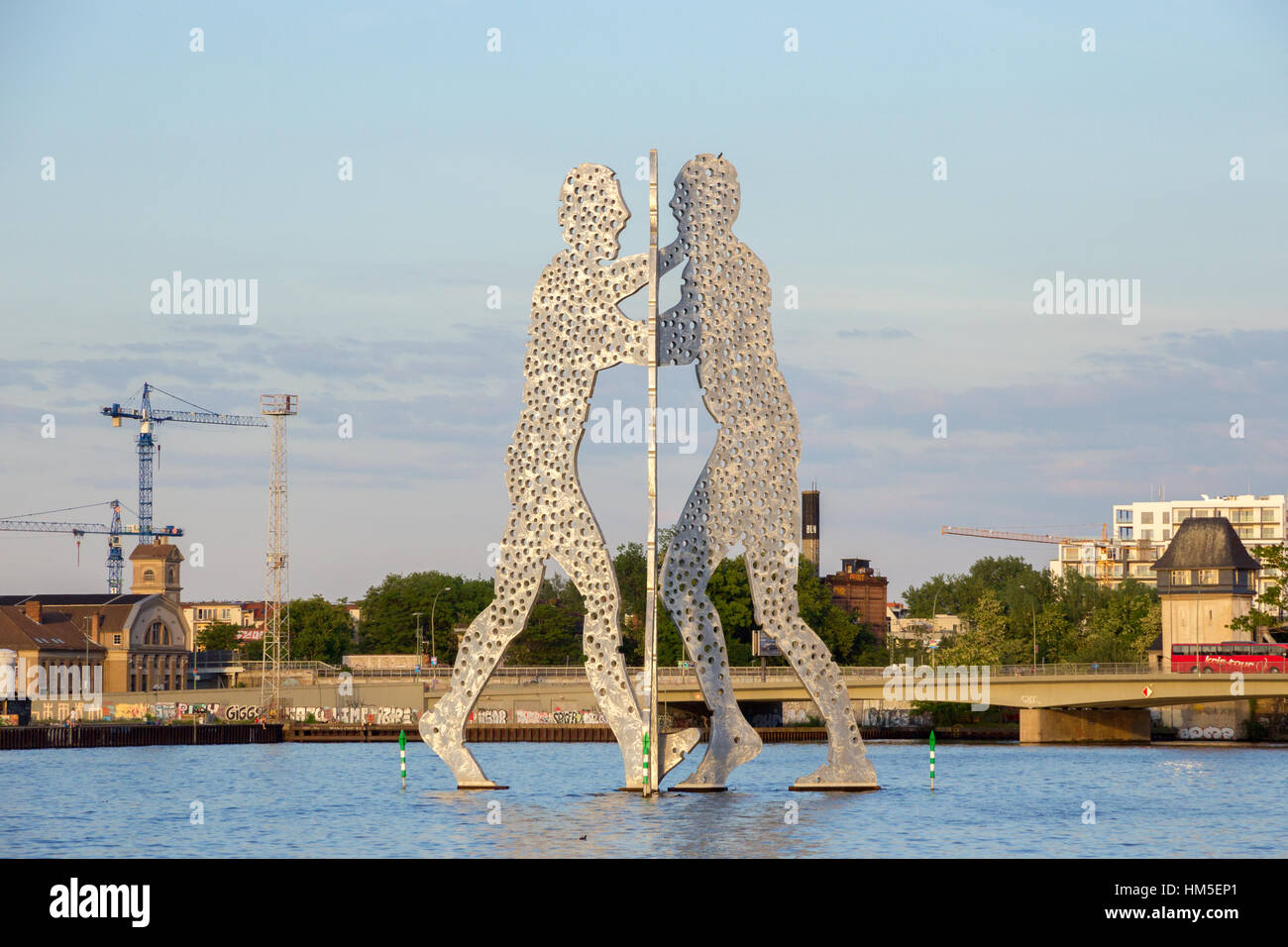 BERLIN - MAY 21, 2014: Molecule Man designed by Jonathan Borofsky. Symbol of the unity of the three restructured in the 2001 district Treptow and Frie Stock Photo