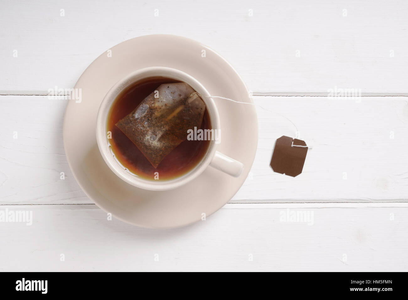 teacup with black tea teabag Stock Photo