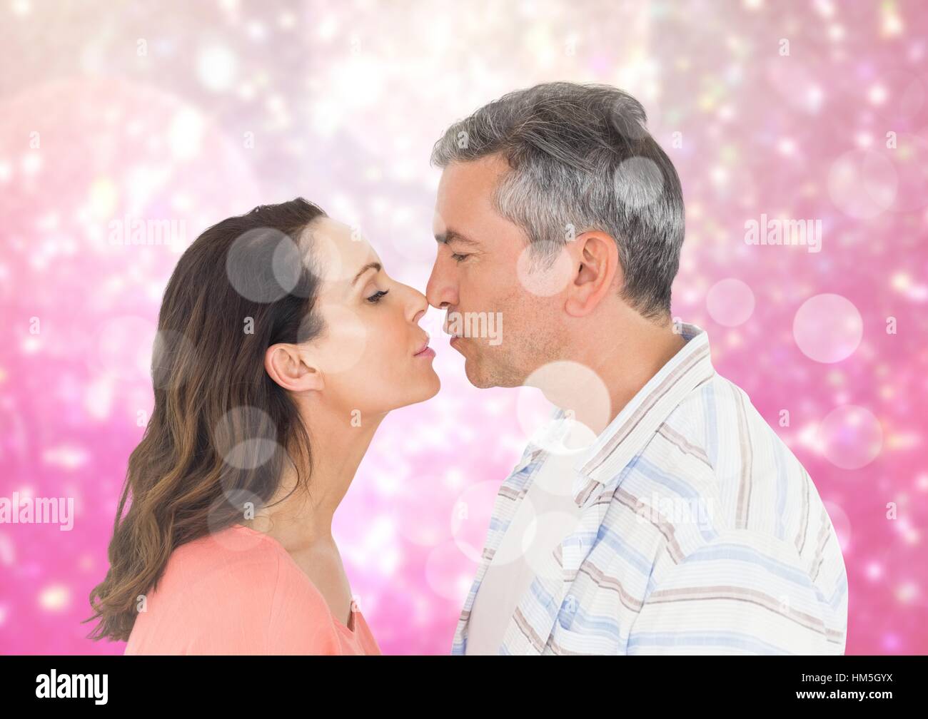 Romantic couple rubbing nose Stock Photo - Alamy