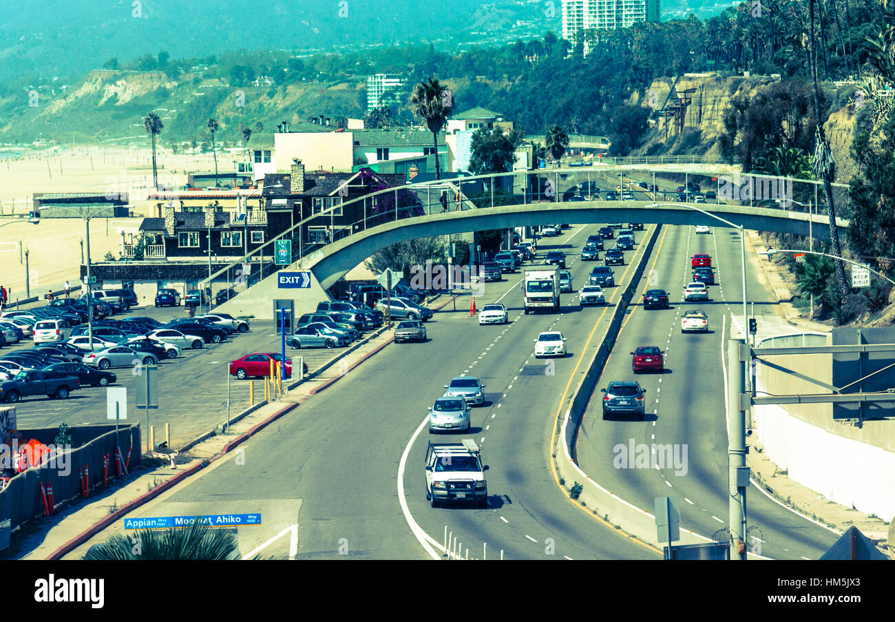 Pacific Coast Highway #1 in Pacific Palisades at the US West Coast - View of traffic travelling south to Santa Monica and Los Angeles, California - Cr Stock Photo