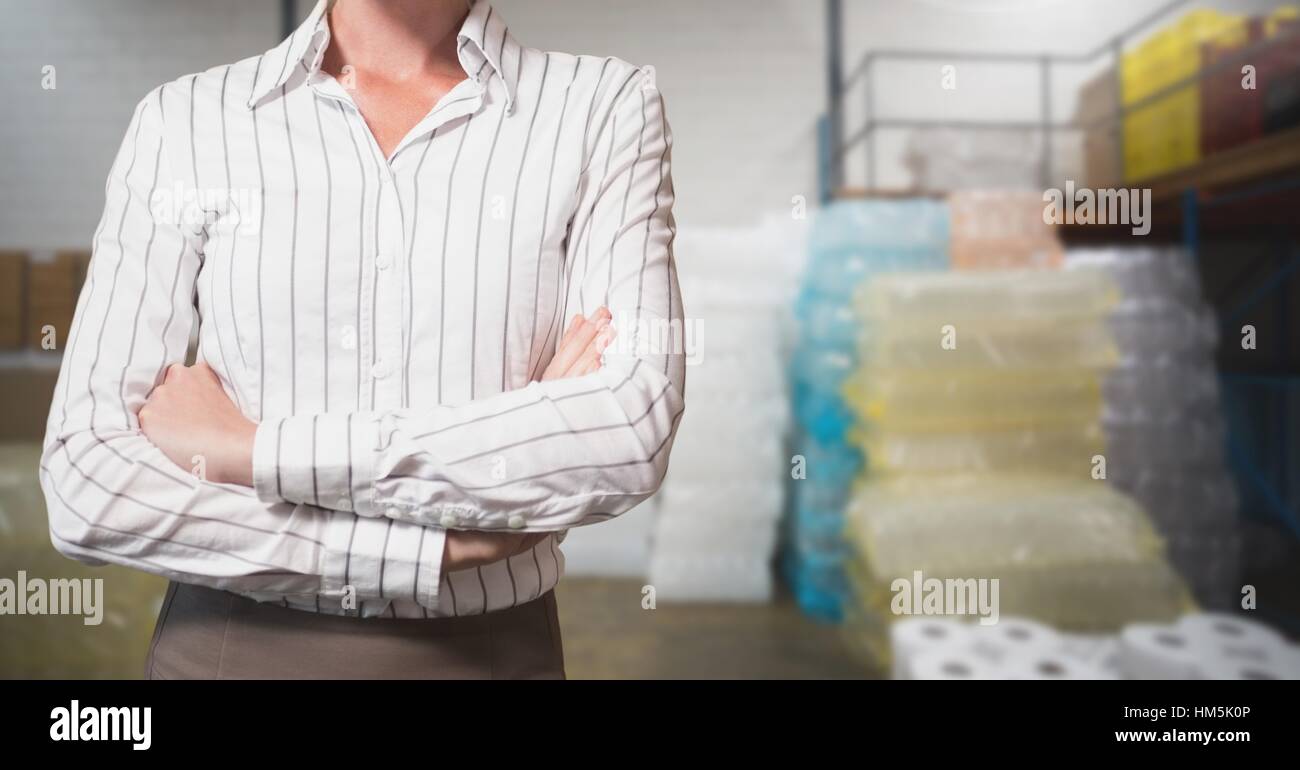 Mid section of businesswoman standing with arms crossed Stock Photo - Alamy