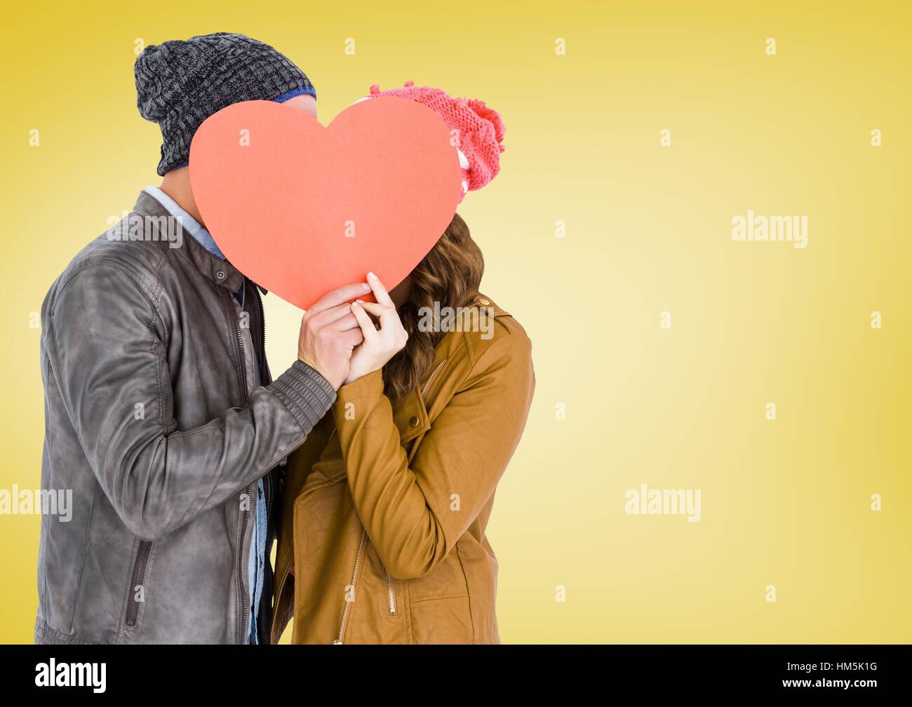 Romantic couple holding heart shape and kissing each other Stock Photo ...