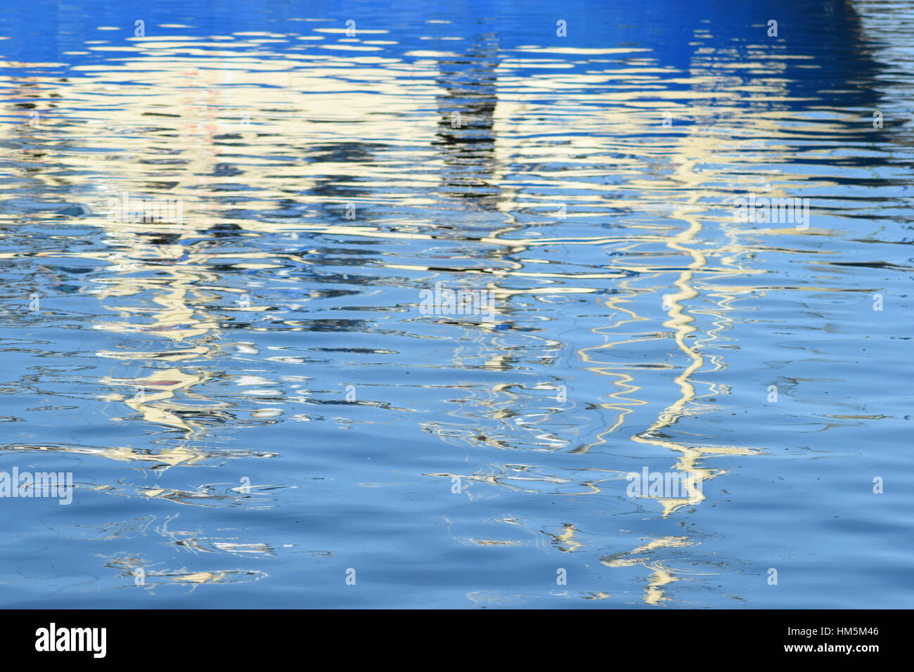 Reflection of fishing boat in the water Stock Photo
