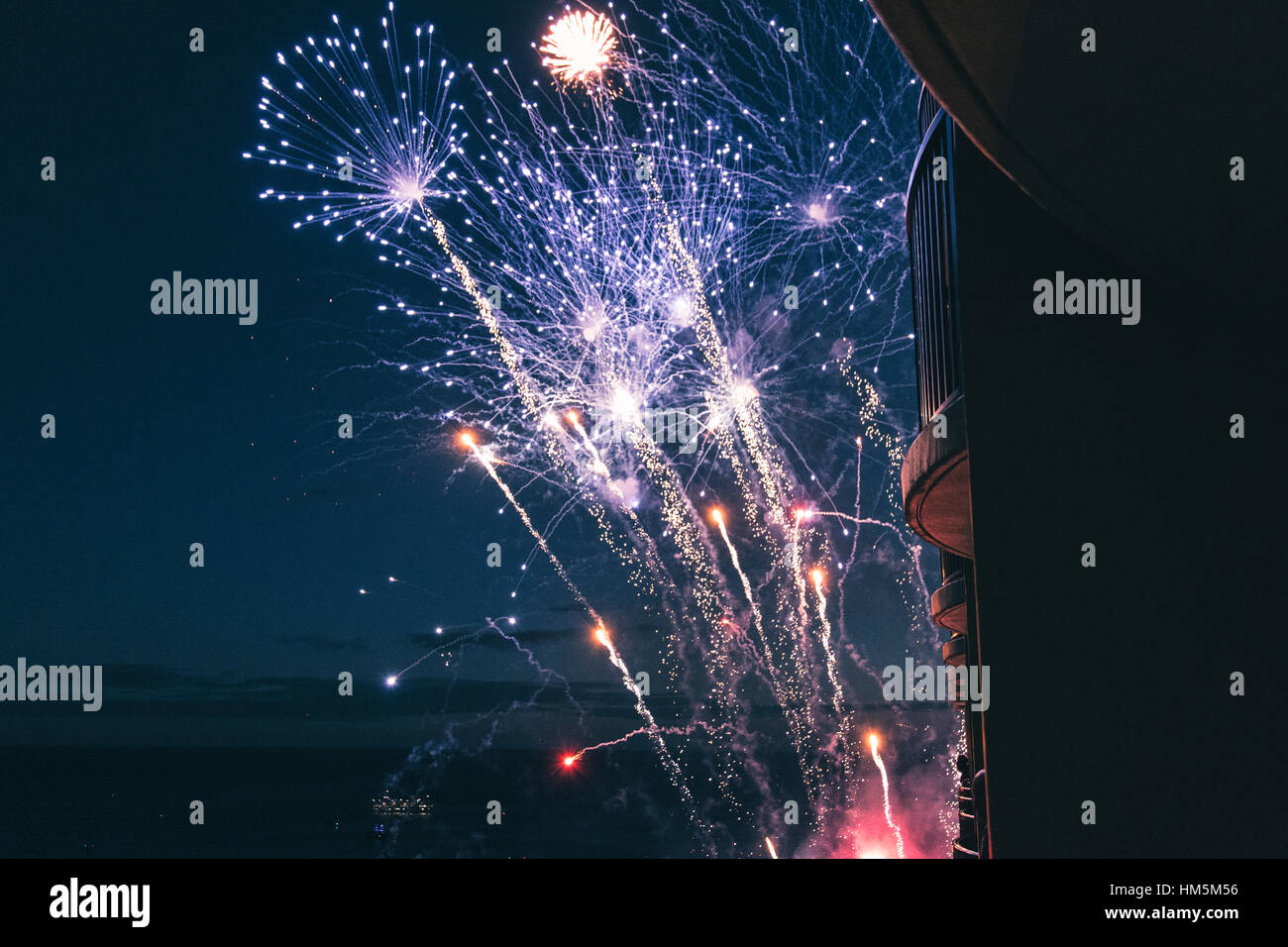 Low angle view of firework display in sky at night Stock Photo