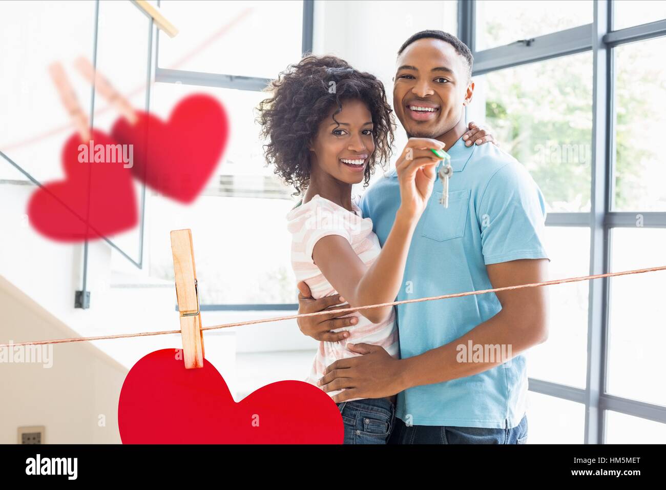 Portrait of happy couple showing new home key Stock Photo - Alamy