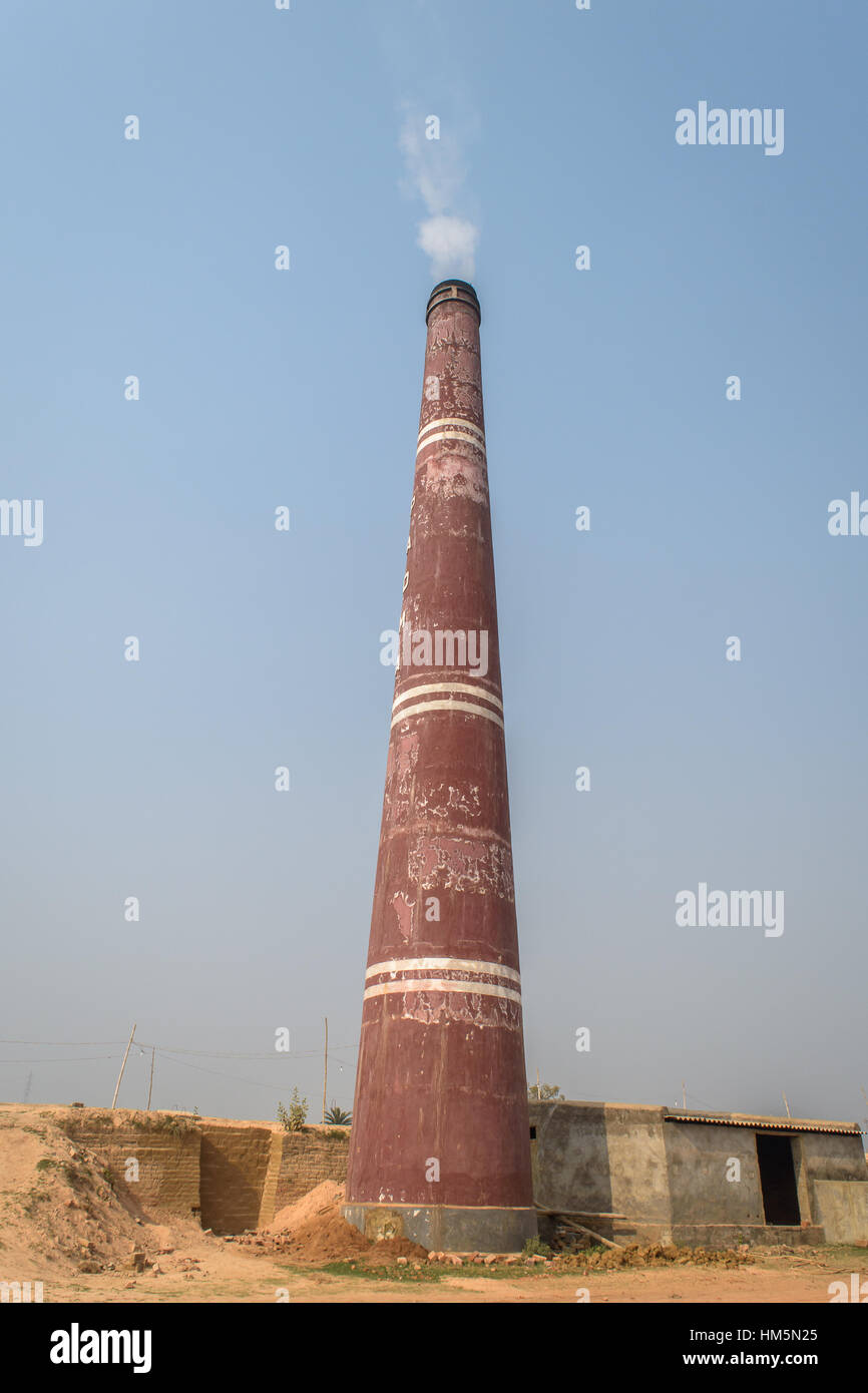 Chimney of a brick making machine Stock Photo Alamy