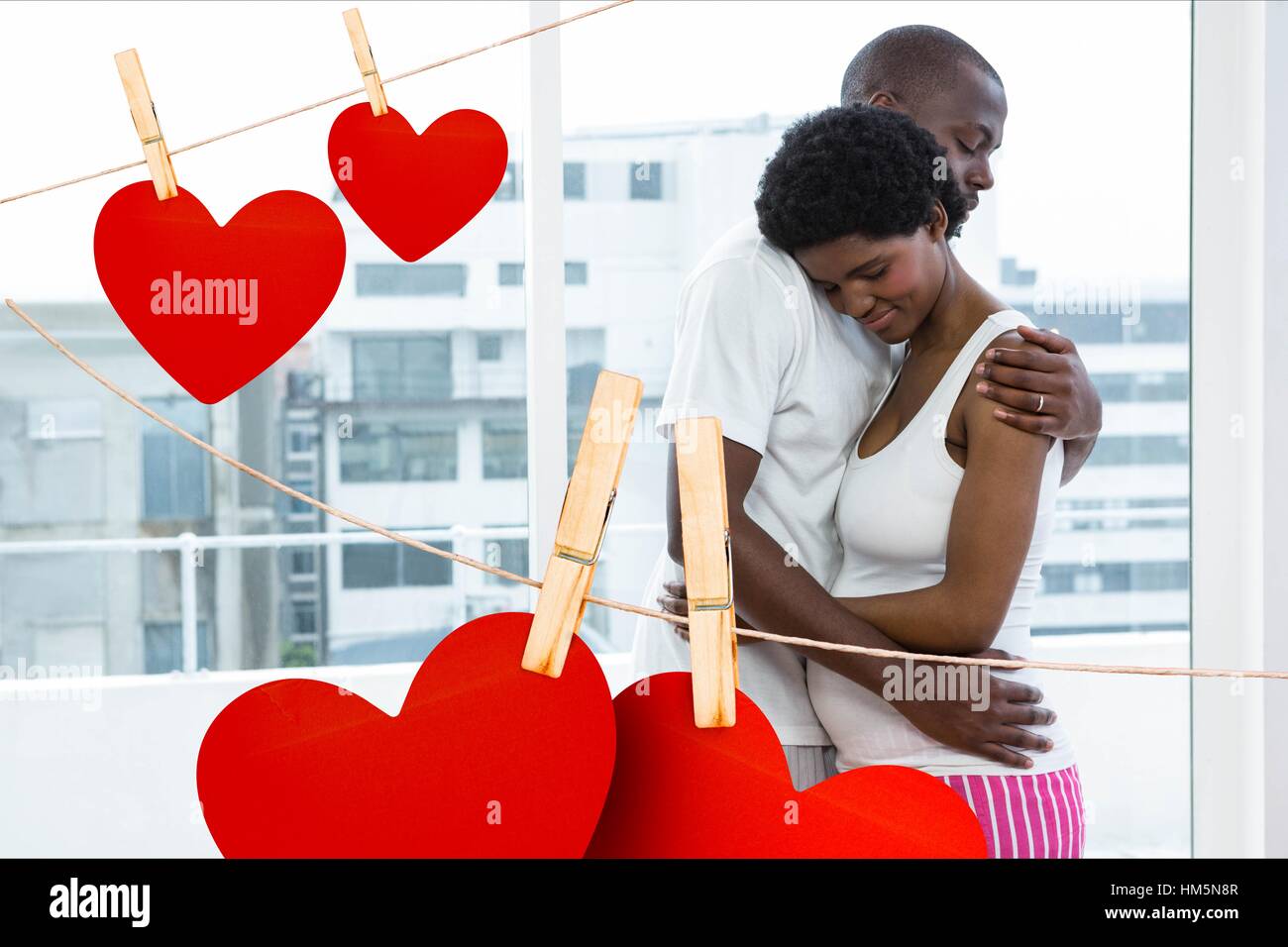 Man embracing pregnant woman Stock Photo - Alamy