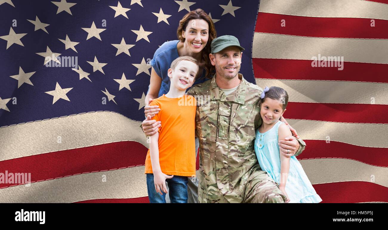 Soldier with his family in front of the US flag Stock Photo