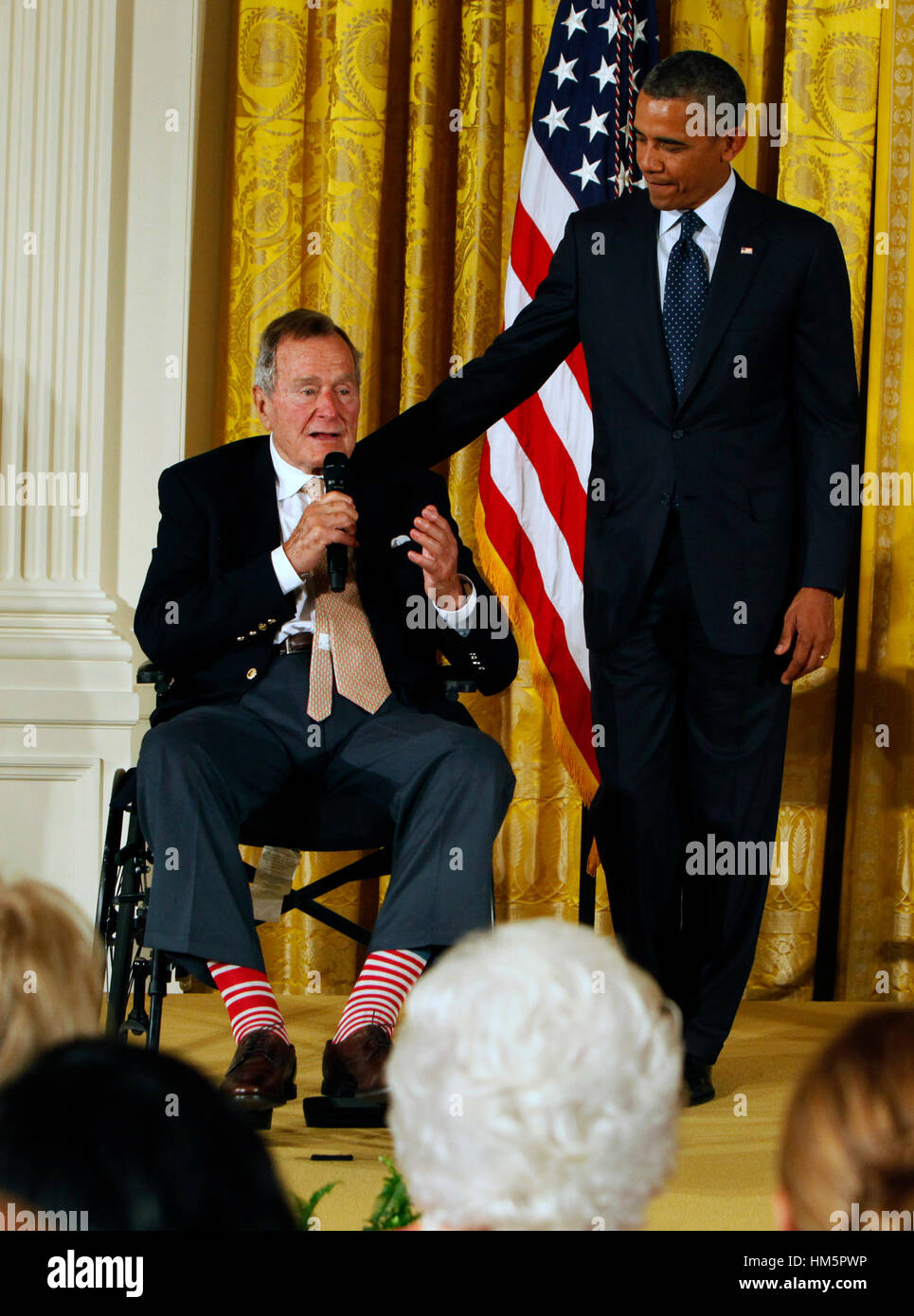 Former United States President George H.W. Bush and U.S. President Barack Obama at a ceremony in the East Room of the White House to present the 5,000th 'Daily Point of Life' on July 15, 2013. Stock Photo