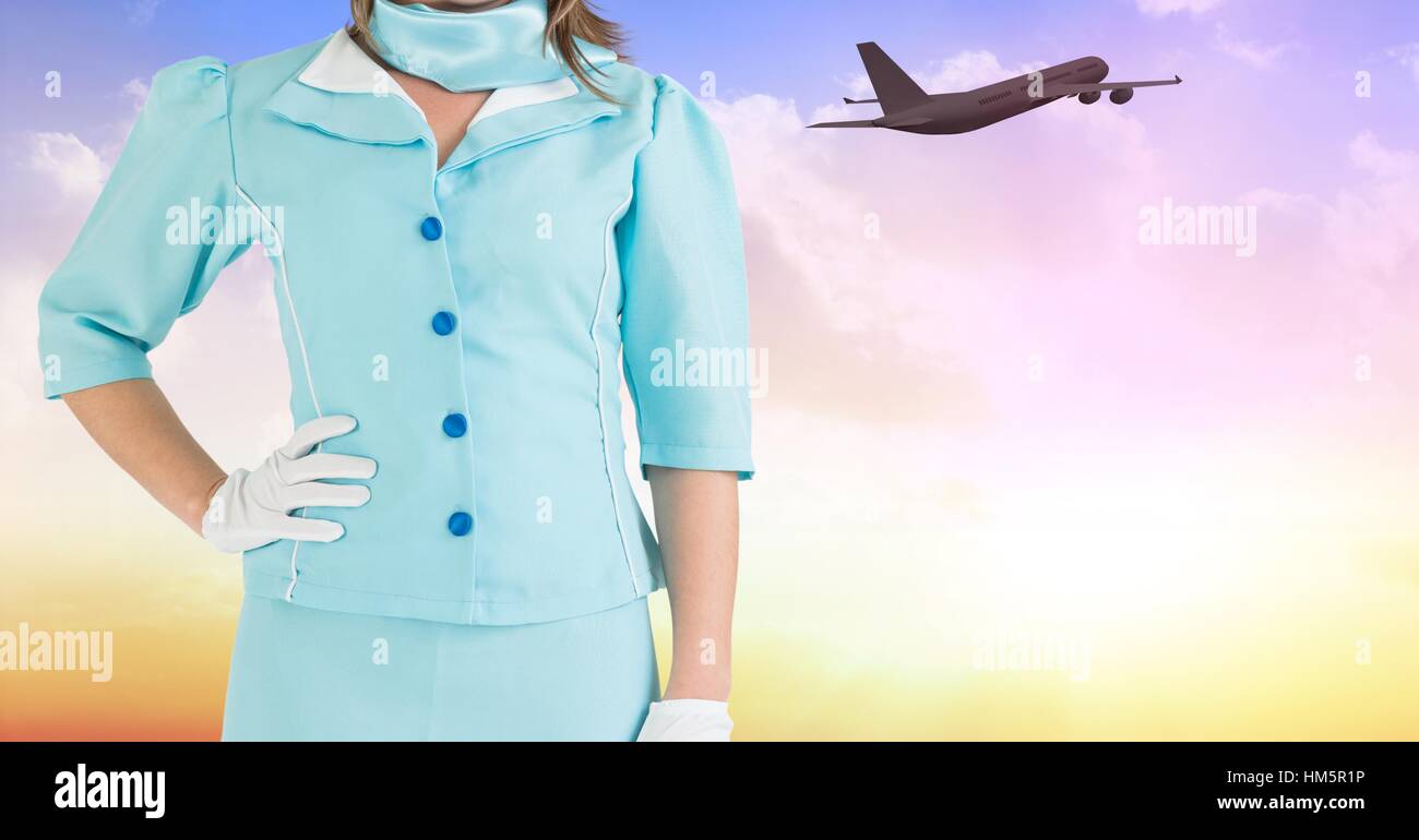 Mid section of air hostess with hands on hip Stock Photo