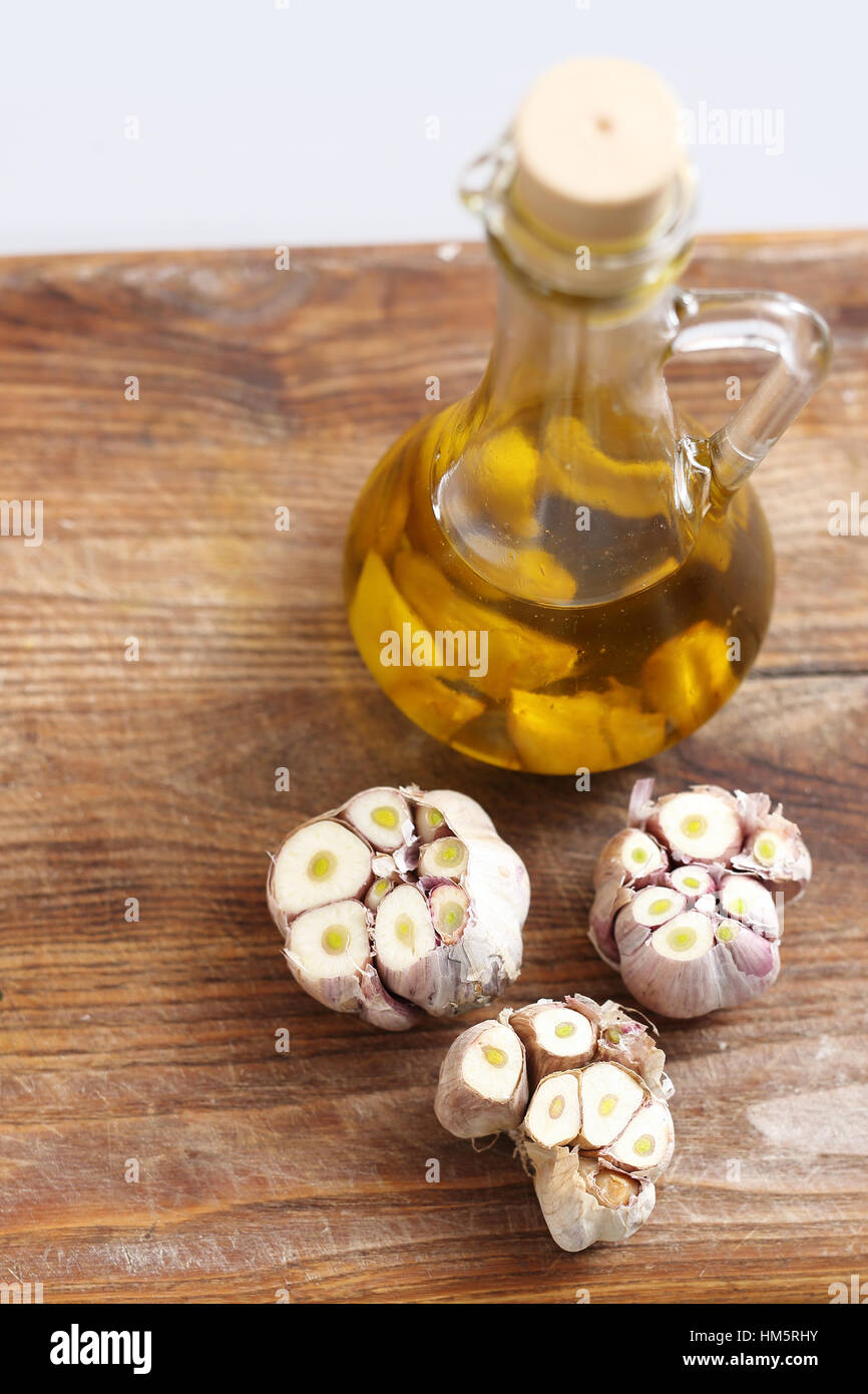 Olive oil with garlic cloves. Olive oil and garlic Olive oil with