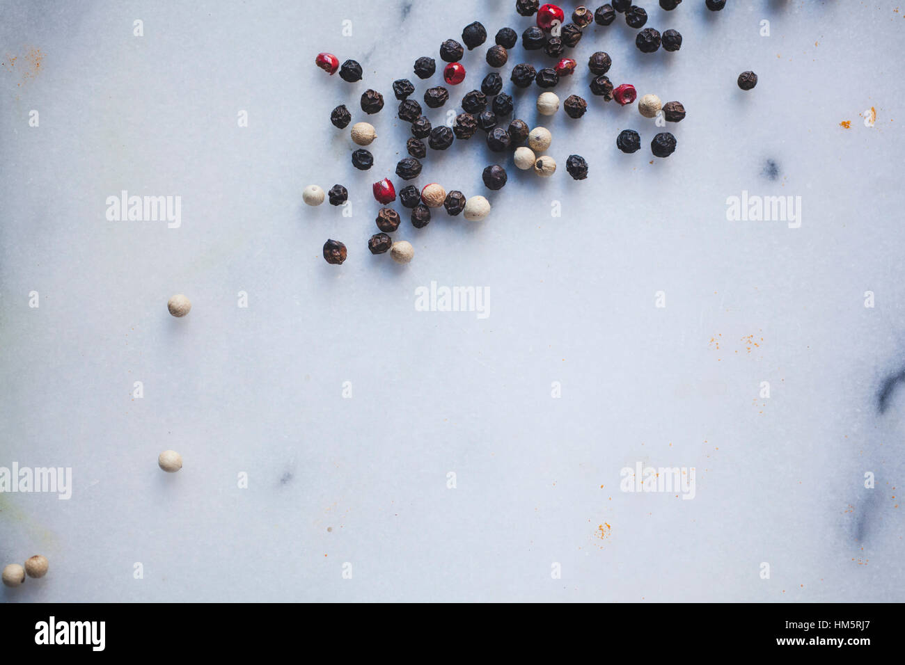 High angle view of peppers on marble Stock Photo