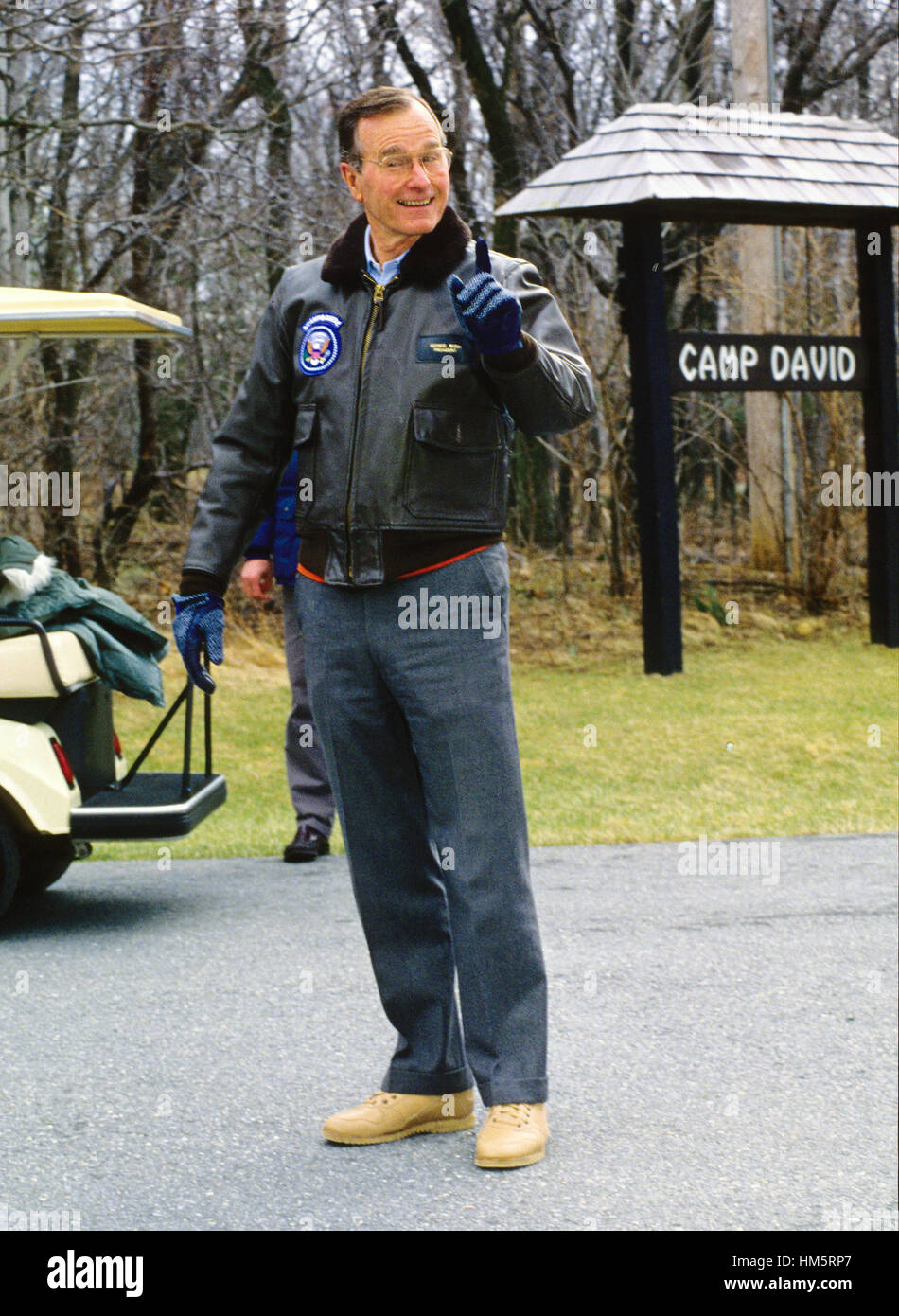 United States President George H.W. Bush kids with the press pool as he  prepares to welcome Chancellor Helmut Kohl of West Germany and his wife to Camp  David, the presidential retreat near