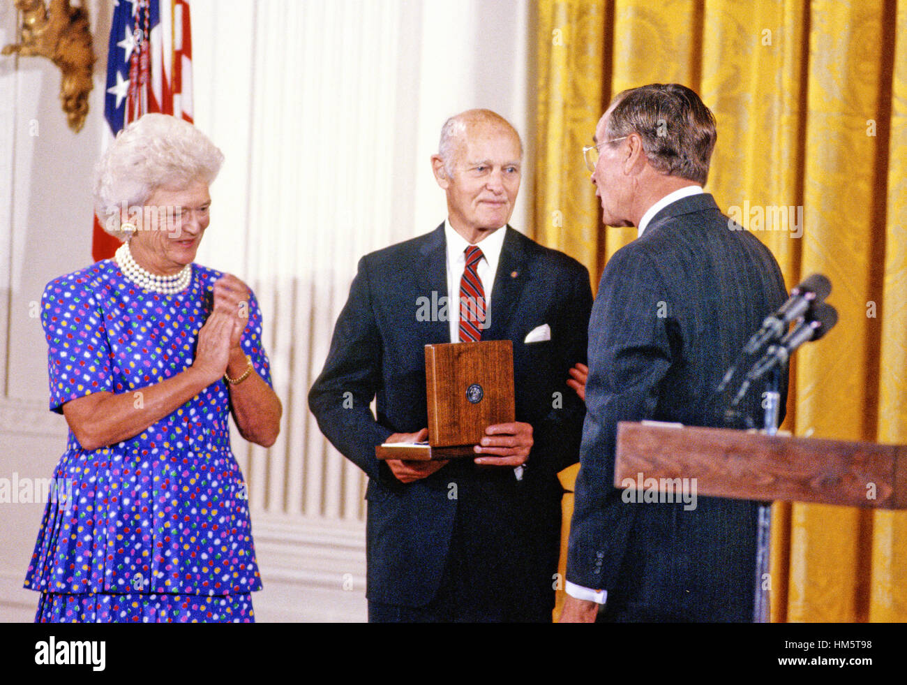 George F. Kennan, Diplomat, Political Scientist, and Historian, center, is awarded the Presidential Medal of Freedom, the highest civilian award of the United States, by US President George H.W. Bush, right, and first lady Barbara Bush, left, in a ceremon Stock Photo