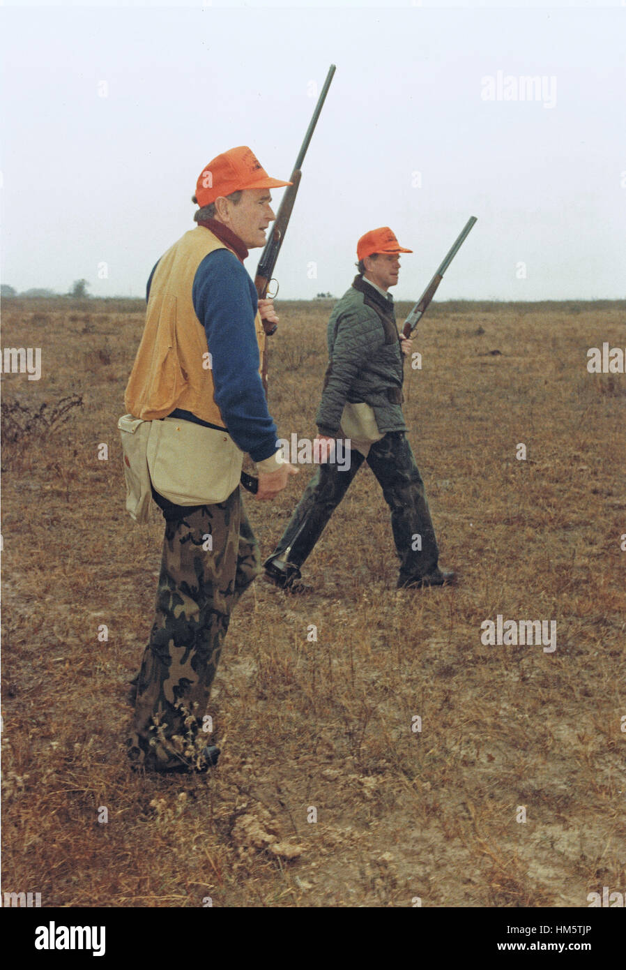 United States President George H.W. Bush, left, and Will Farish hunt quail on the Lazy F Ranch near Beeville, Texas on December 28, 1989. Mandatory Stock Photo