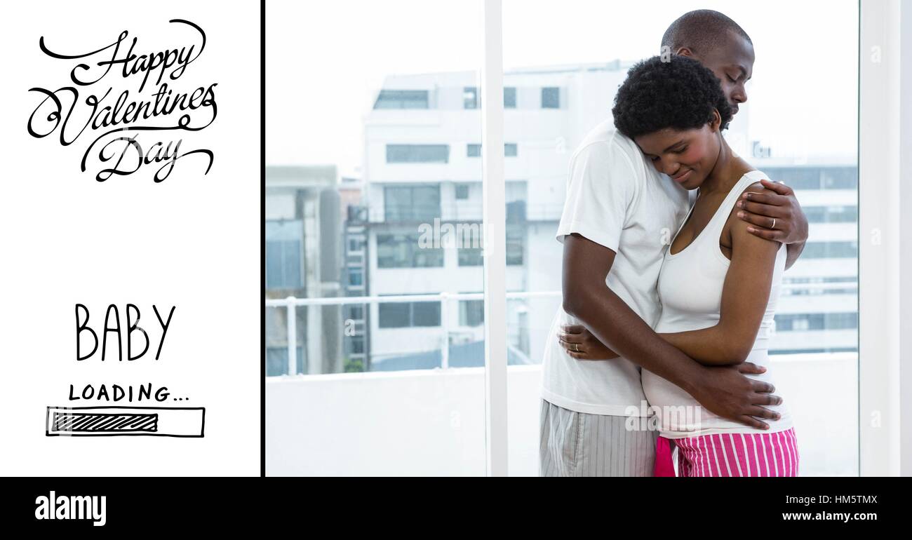 Man embracing pregnant woman and valentines text Stock Photo - Alamy