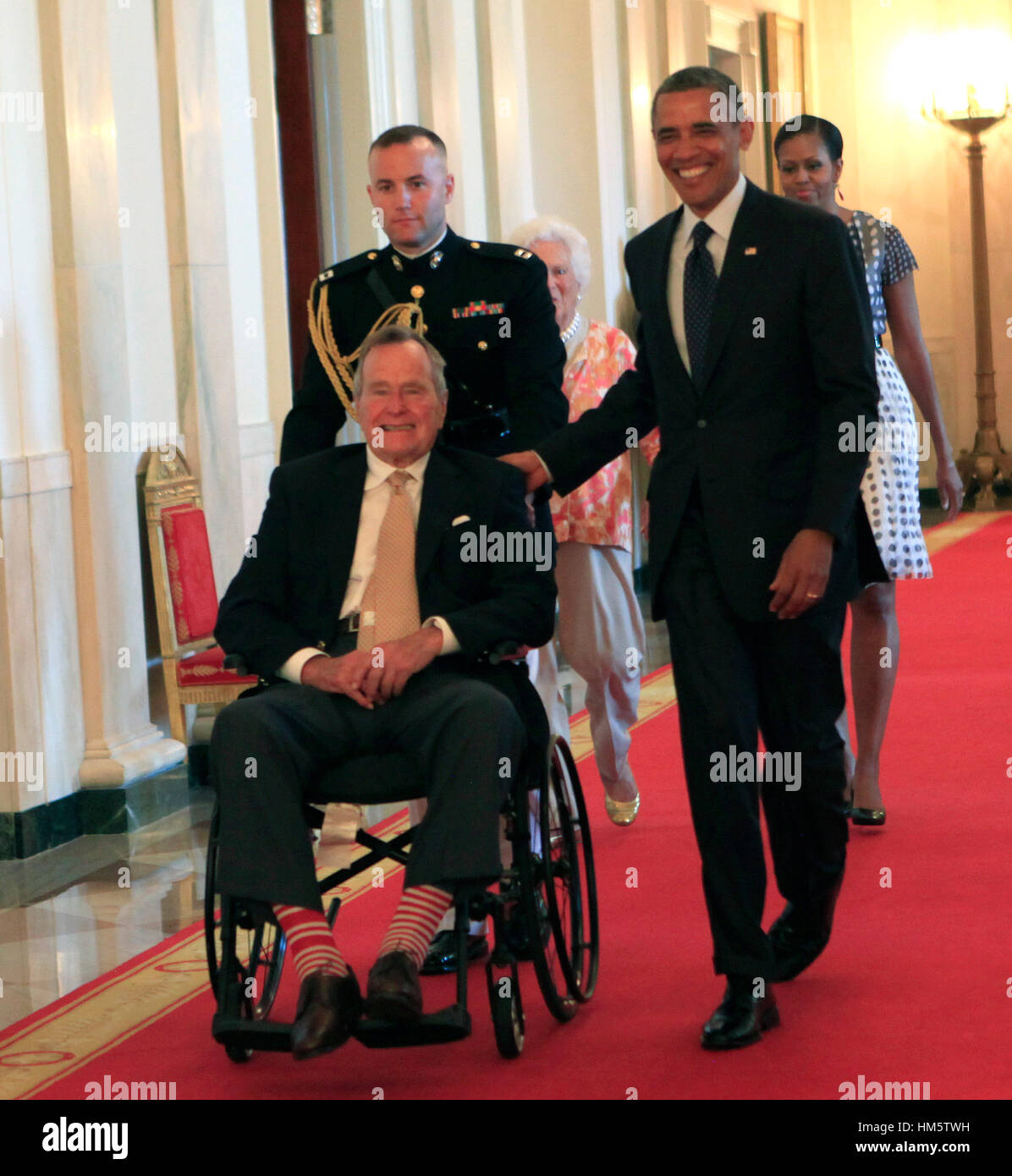 Former United States President George H.W. Bush and U.S. President Barack Obama at a ceremony in the East Room of the White House to present the 5,000th 'Daily Point of Life' on July 15, 2013. Stock Photo