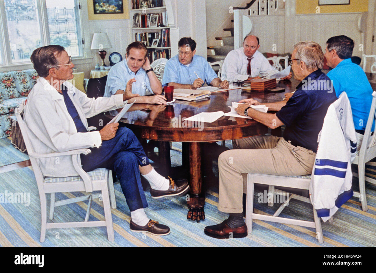 United States President George H.W. Bush meets with senior advisors to discuss the fiscal year 1991 budget and the costs of the Persian Gulf conflict at his home at Walkers Point in Kennebunkport, Maine August 22, 1990. Mandatory Stock Photo