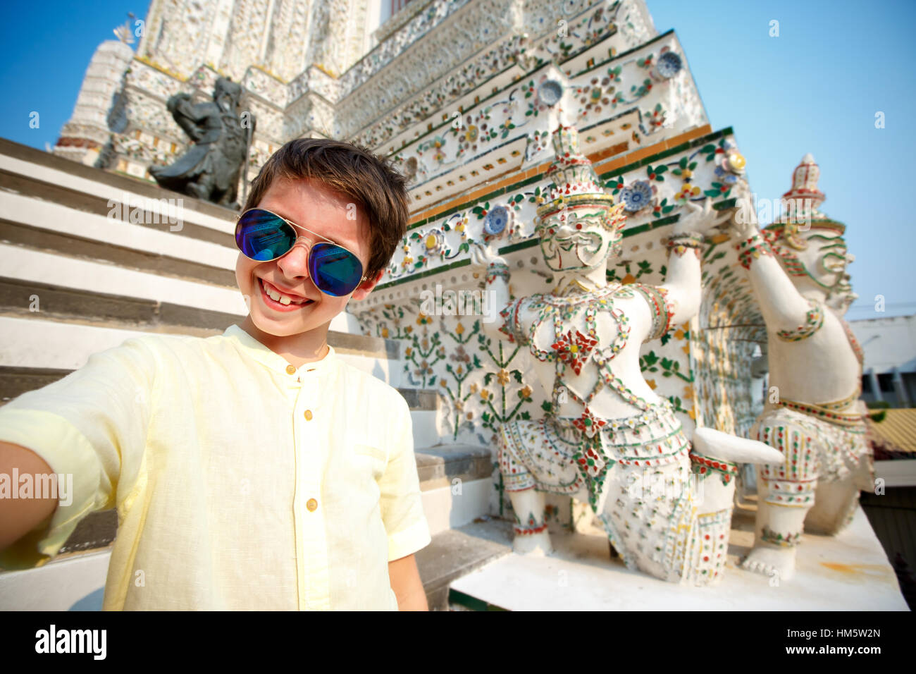 Cute little boy taking a selfie at temple Wat Arun, Thailand Stock Photo