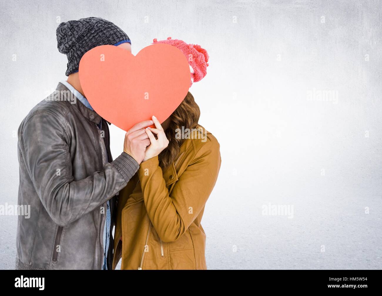 Romantic couple holding heart shape and kissing each other Stock Photo ...