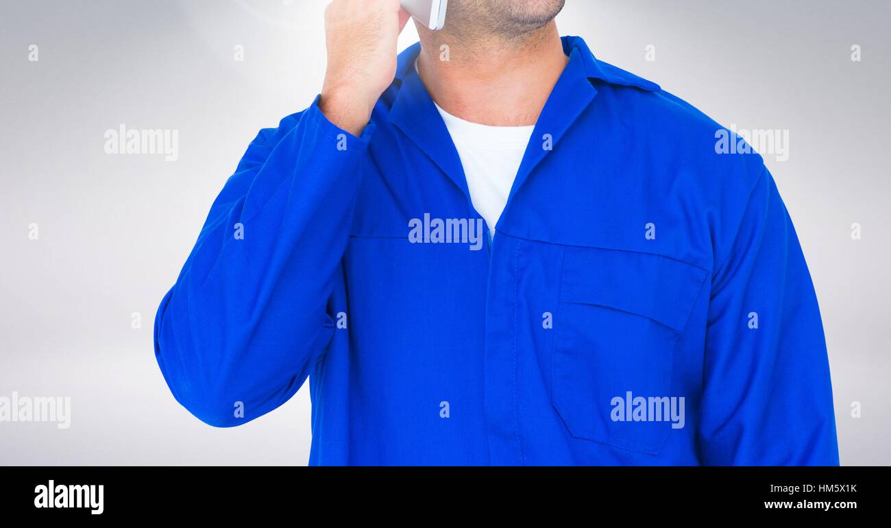 Mid section of serviceman talking on mobile phone Stock Photo