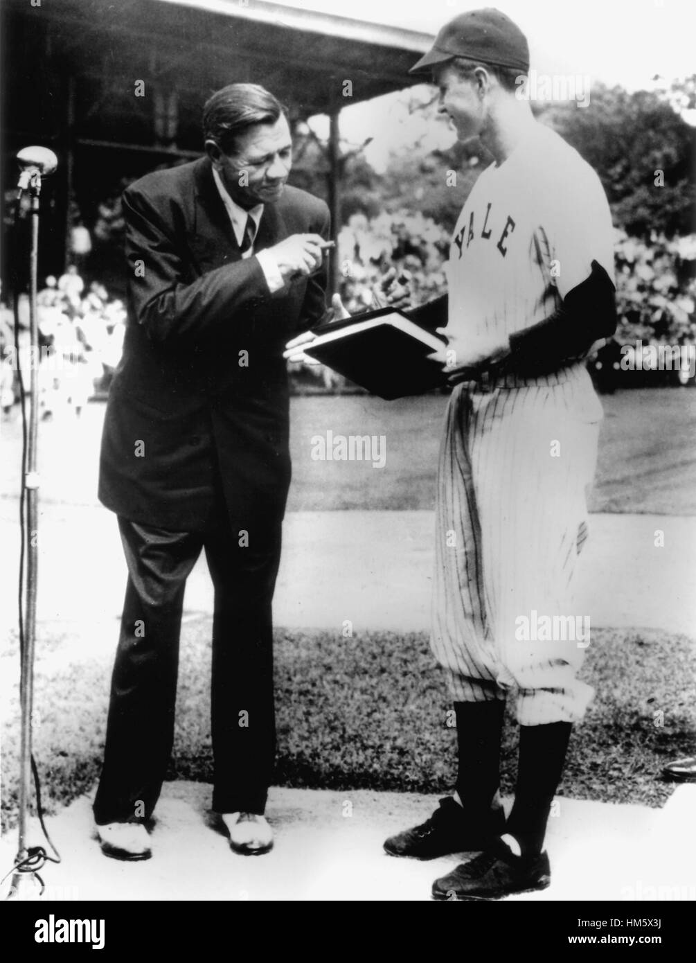 New Haven, Connecticut - Undated file photo -- On behalf of Yale University, Yale Baseball Captain George Bush accepts 'The Babe Ruth Story' autobiography from Babe Ruth in 1948..Credit: White House via CNP /MediaPunch Stock Photo
