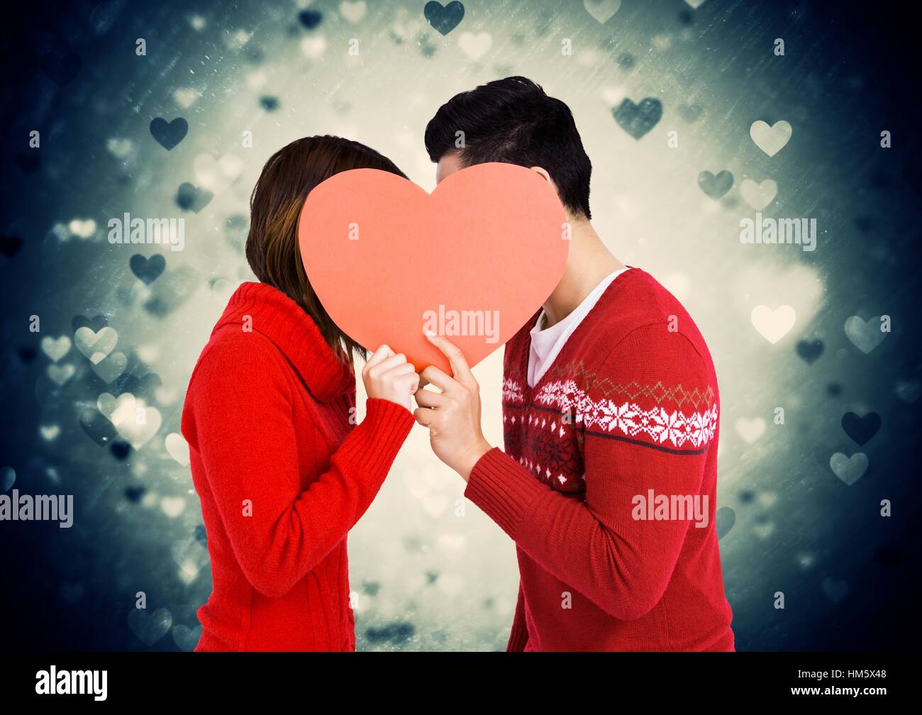 Romantic couple holding heart shape and kissing each other Stock Photo ...