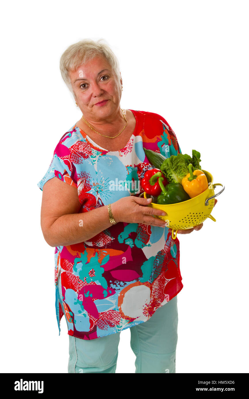 Female senior with fresh vegetables - isolated on white background Stock Photo
