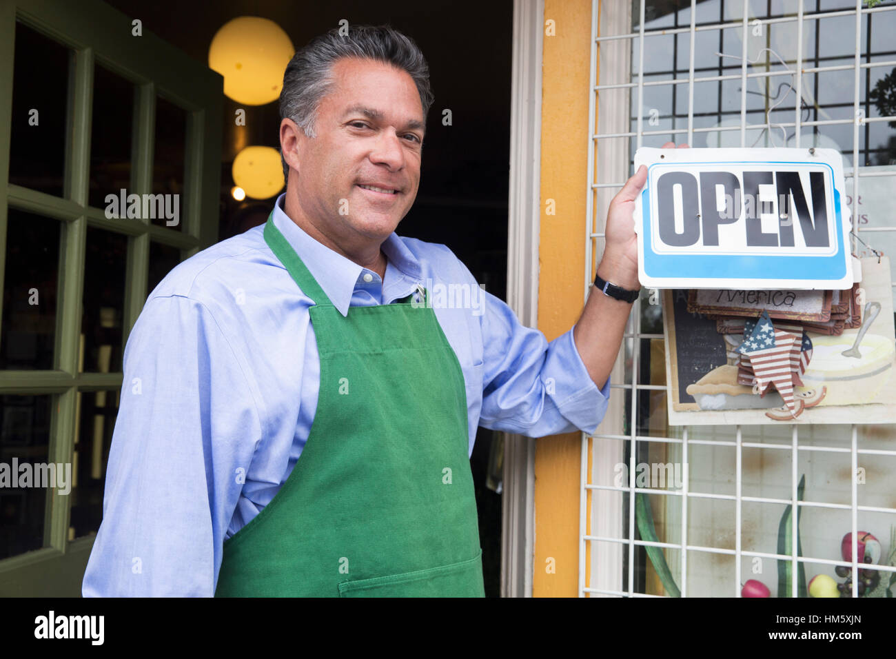 Portrait of male florist holding open sign Stock Photo Alamy