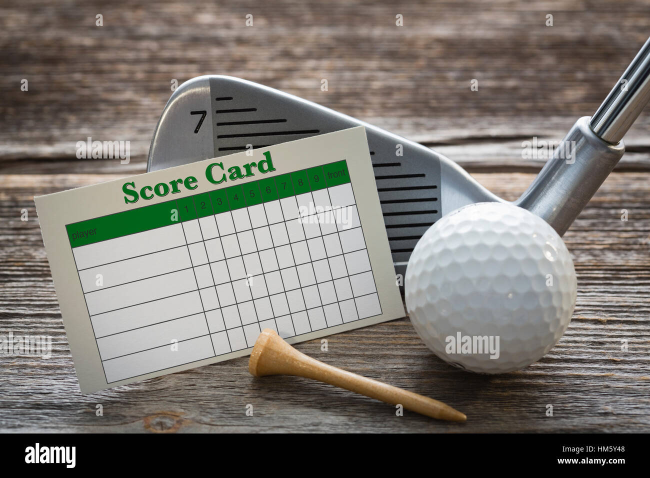 Golf club, ball, tee and score card Stock Photo