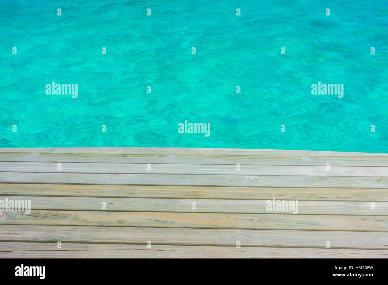 Wooden planks in tropical Maldives island and beauty of the sea with